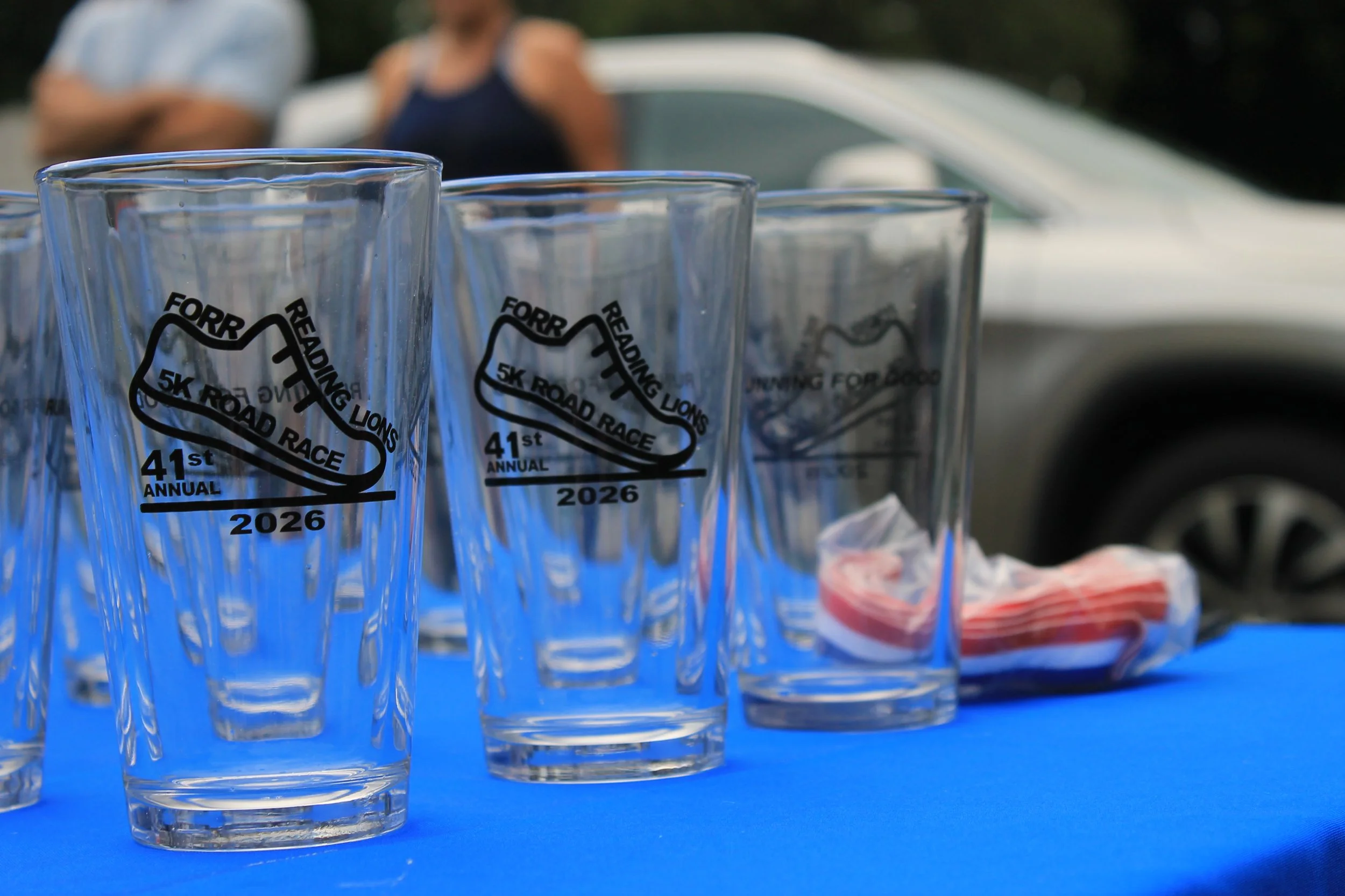 Pint glasses printed for the 41st Annual Reading Lions 5K Road Race wait to be handed out to top finishers.