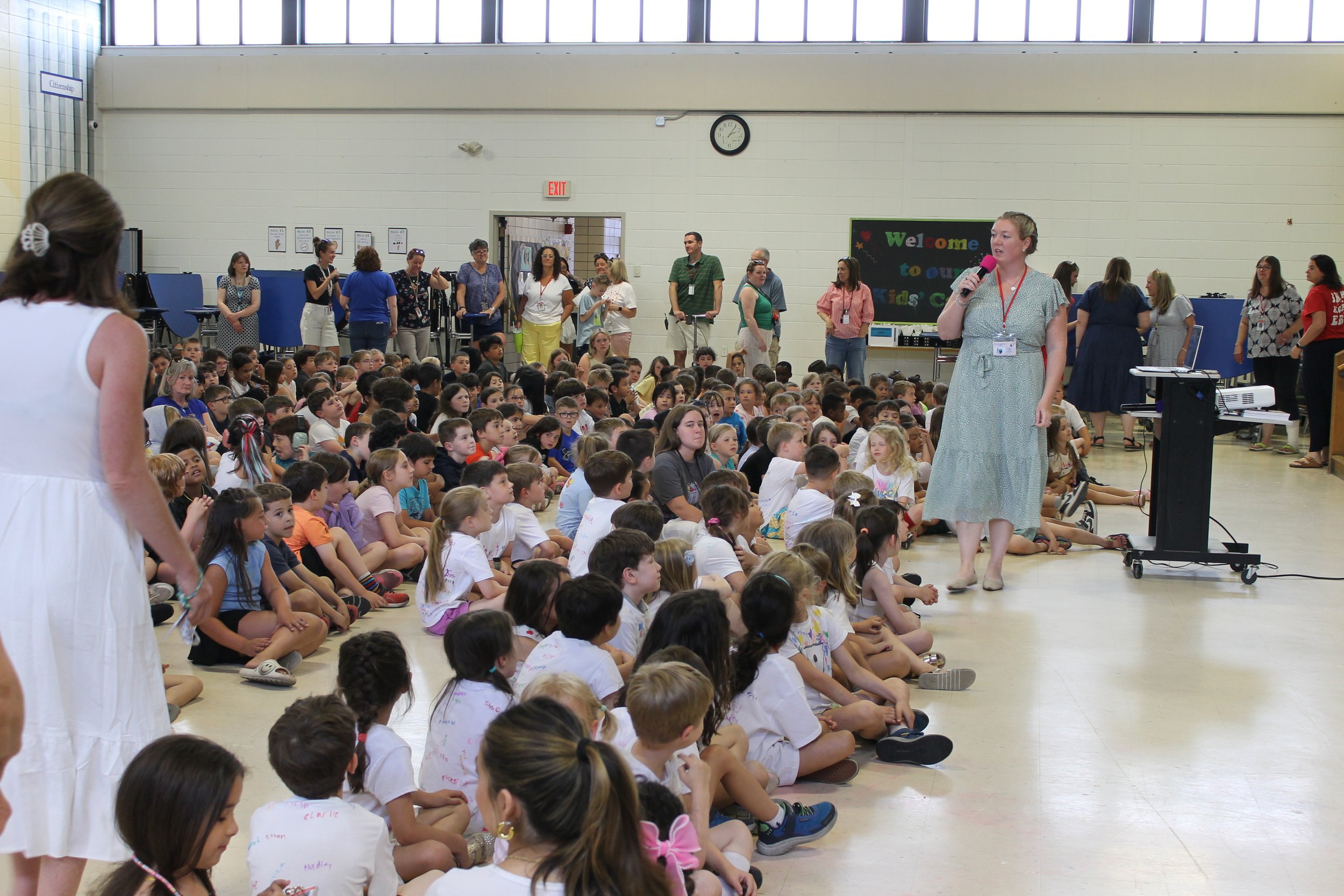 Killam Principal Lindsey Fulton addresses students in the cafeteria at the start of the school's June groundbreaking celebration.