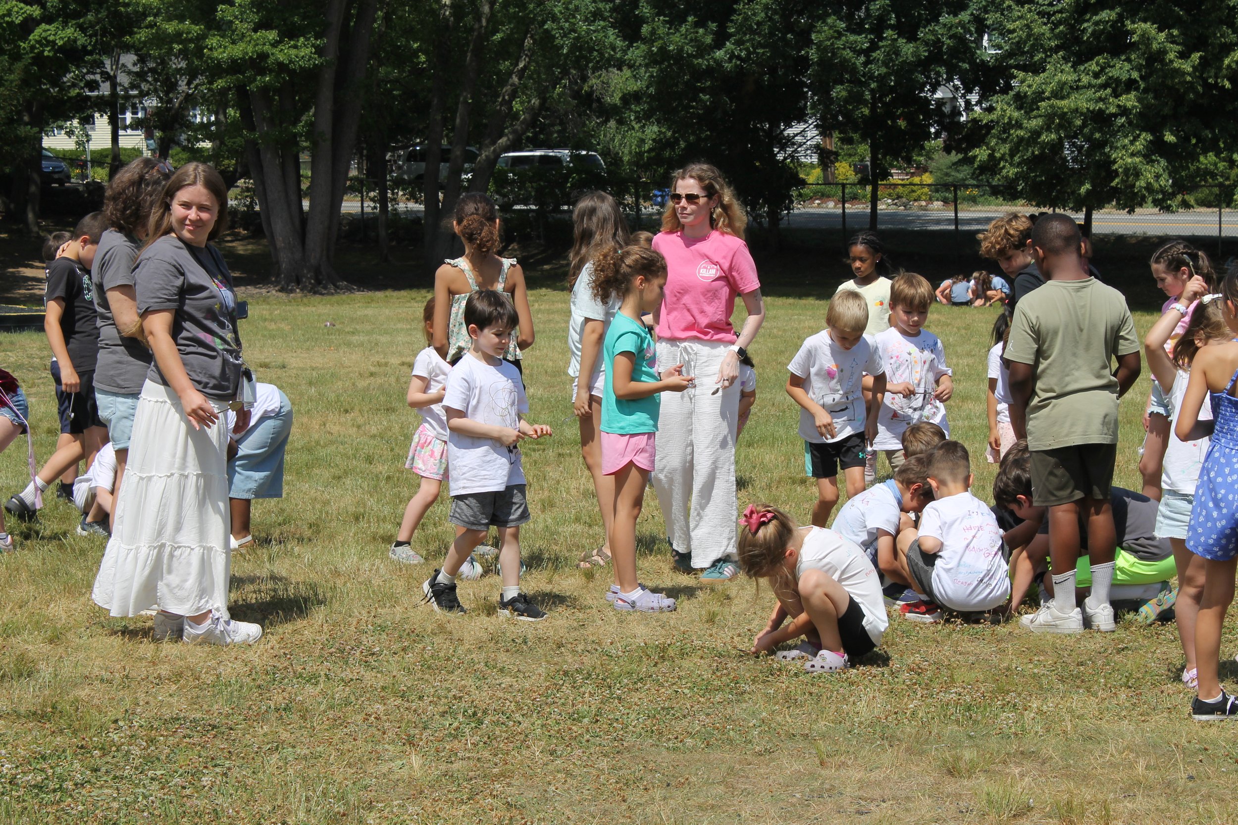 Killam staff and students take part in the groundbreaking activity on the back field.