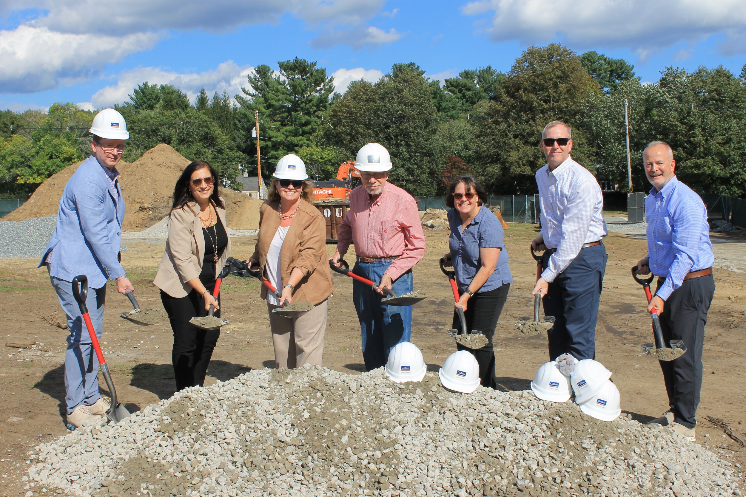 Members of the Killam School Building Committee take part in the ceremonial groundbreaking at Killam Elementary School.