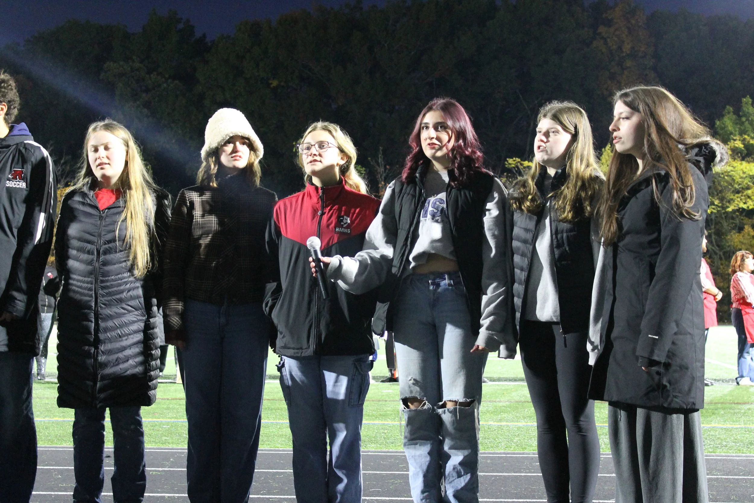Members of the RMHS Choir sing the national Anthem before the awards ceremony.