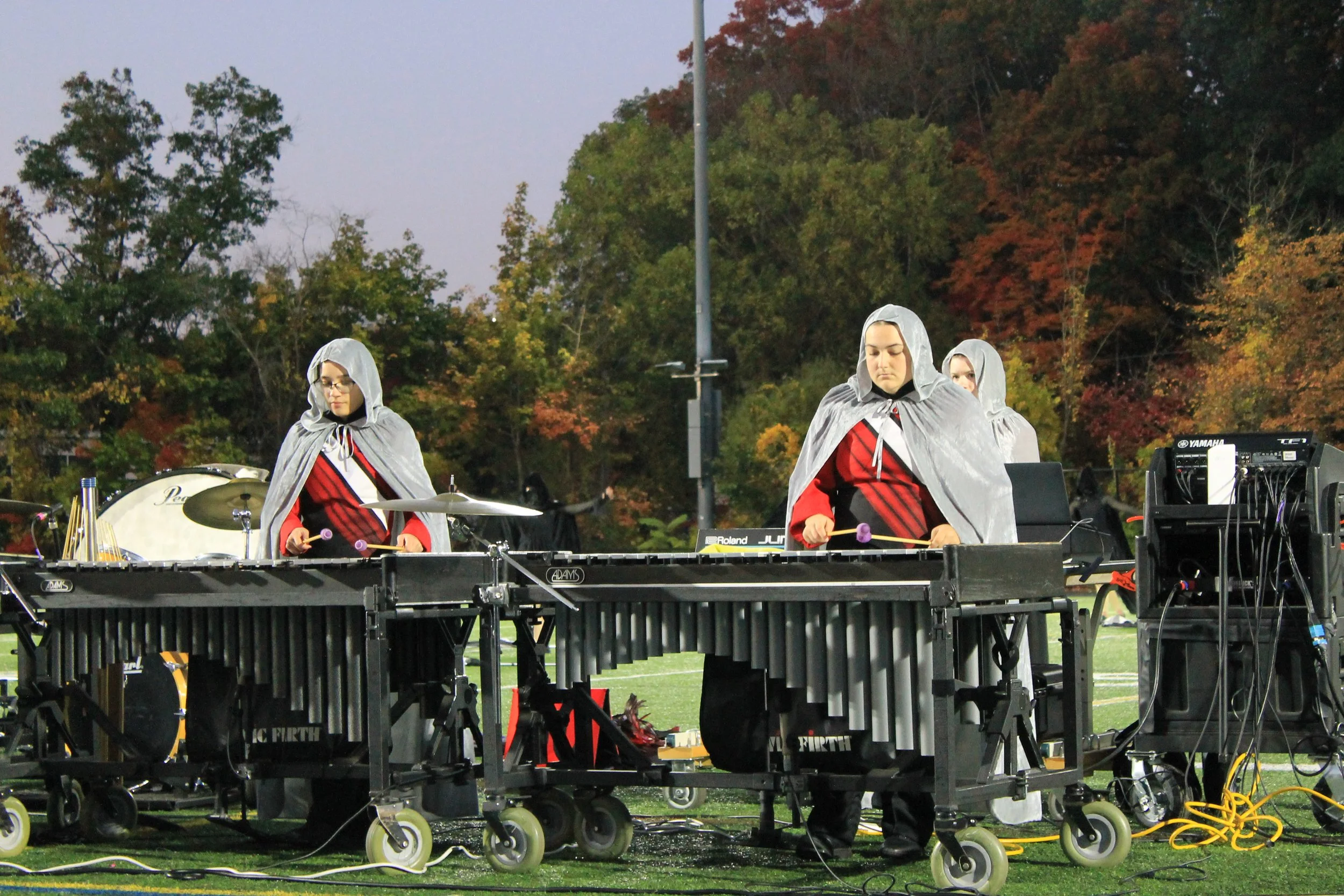 Percussionists perform on marimbas as part of the show's front ensemble.