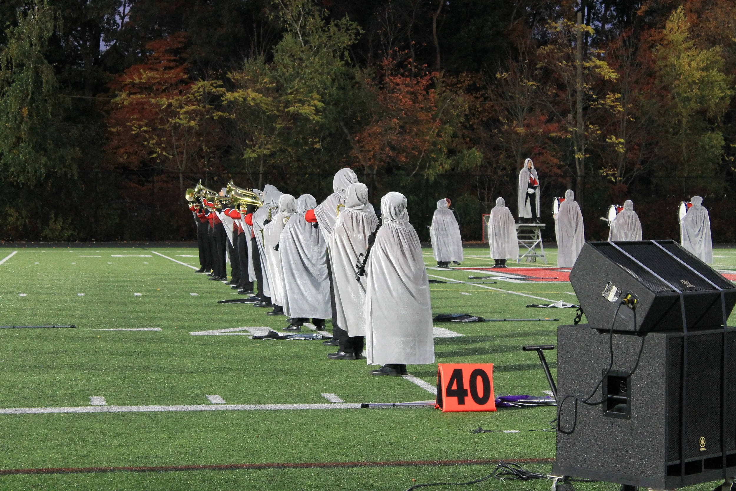 Band members in silver capes at the start of the RMHS Nevermore performance.