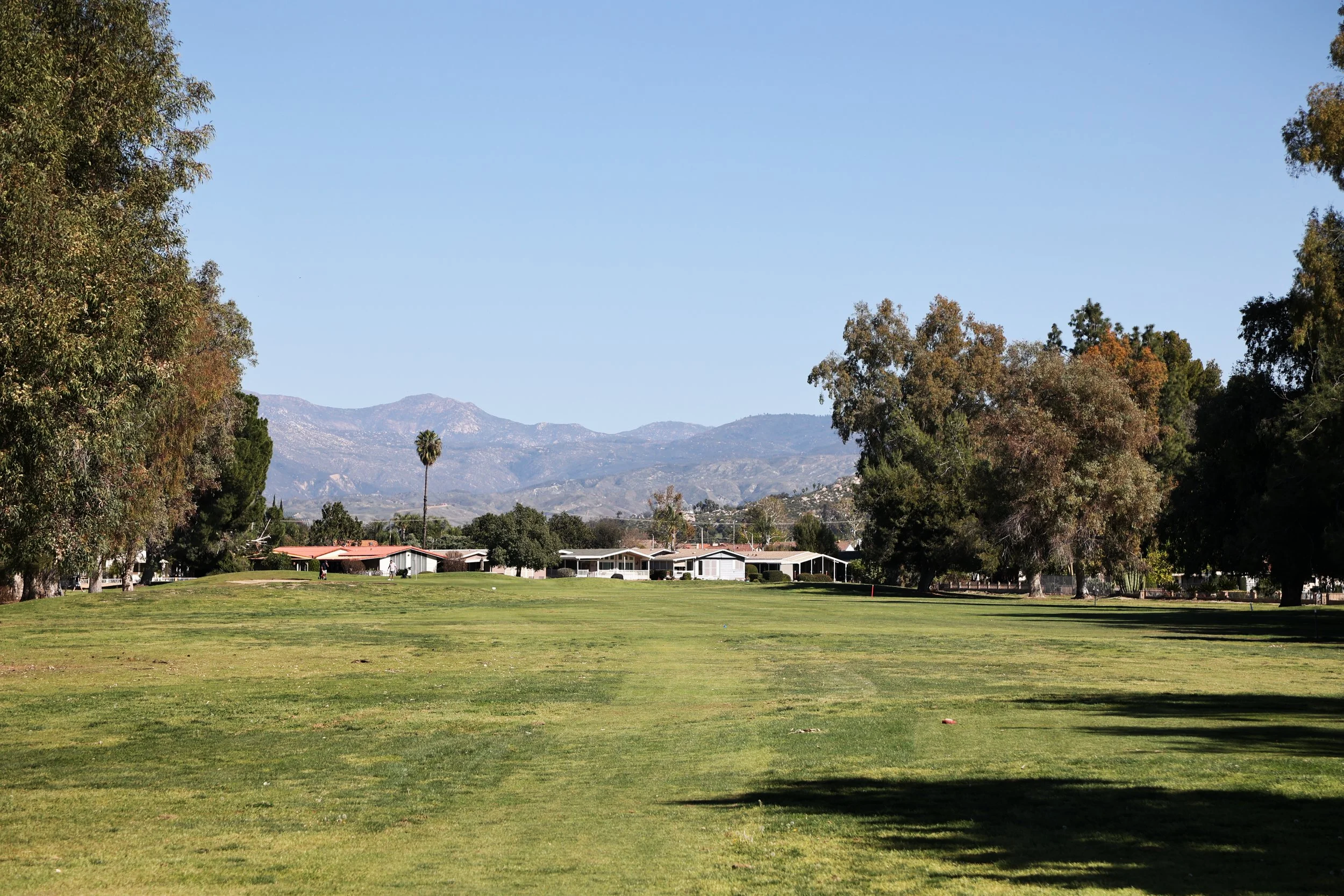 Seven Hills Golf Club fairway with mountain scape in the background