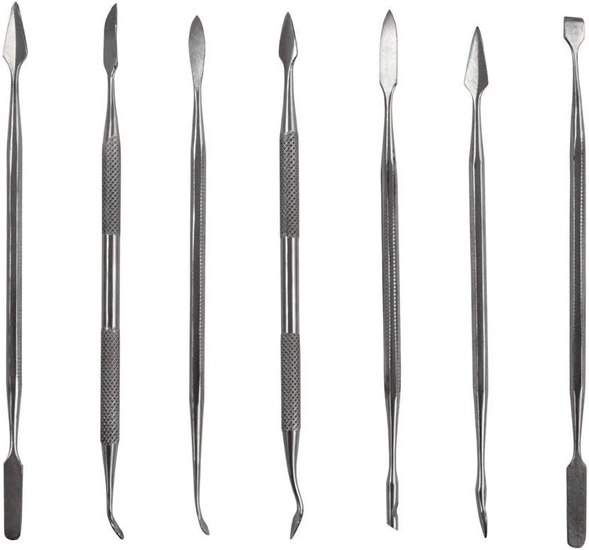 Set of seven dental extraction tools arranged in a row, each made of stainless steel with various shapes and sizes.