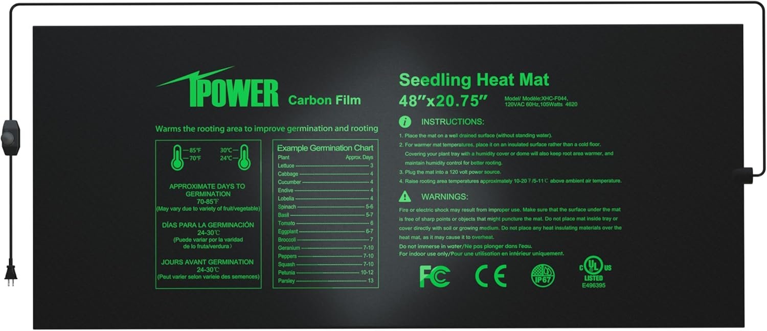 Black seedling heat mat with green text instructions and labels for planting various vegetables and herbs, featuring a power cord on the left side.