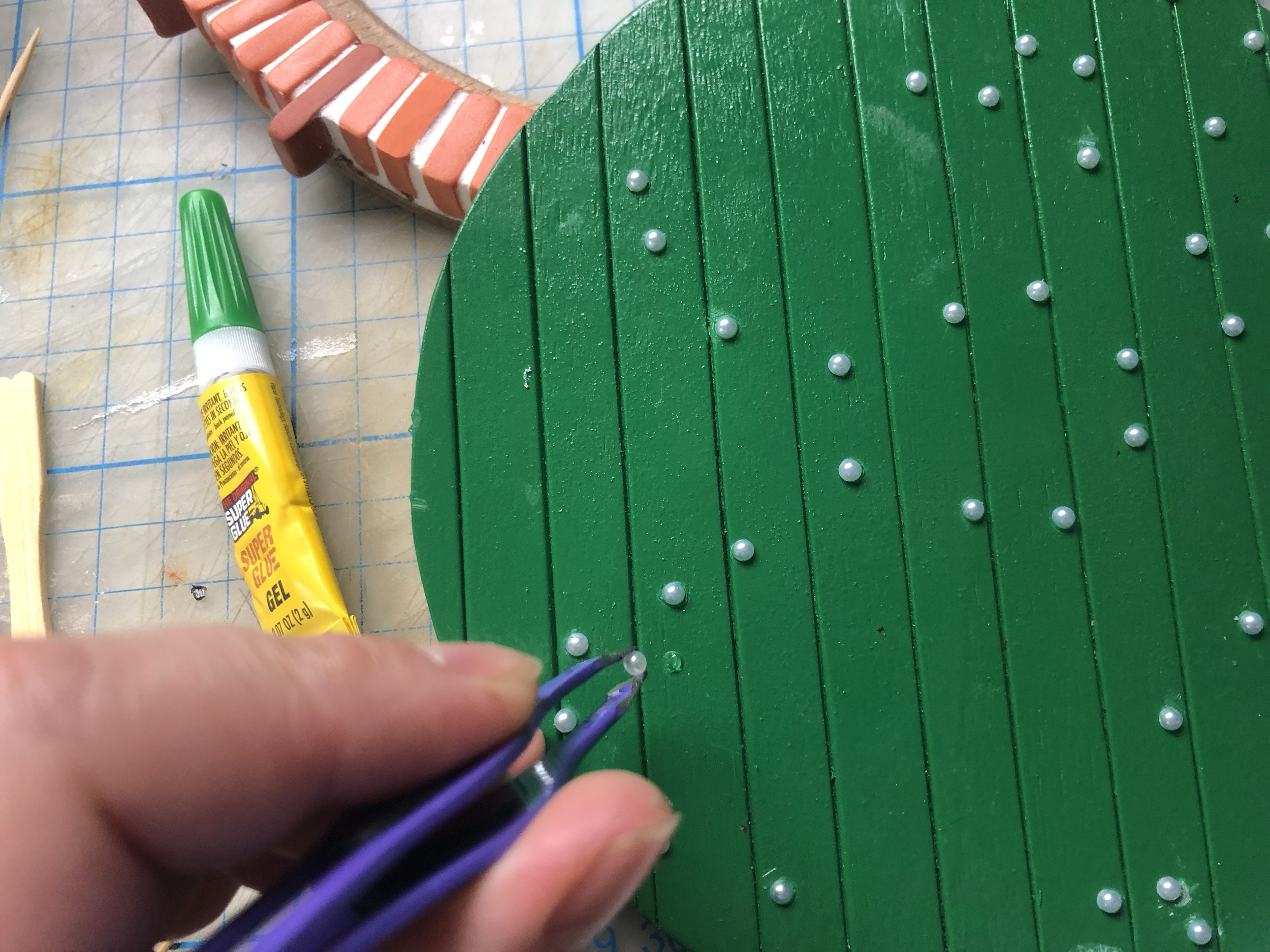 I used tiny half pearl rhinestones for the door bolts/nails