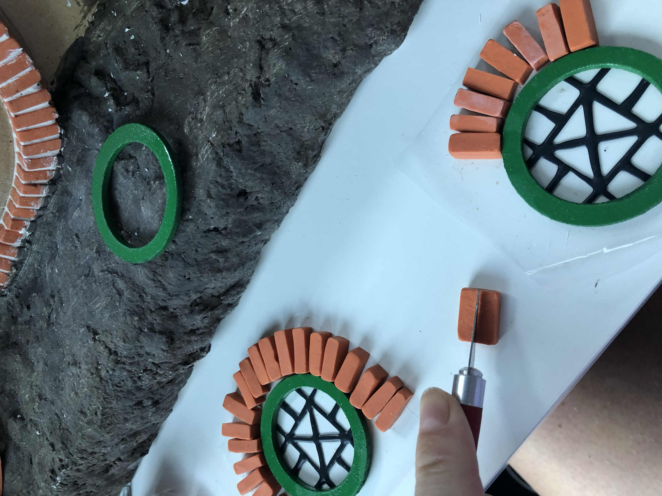 Using faux leading, I drew on a couple pieces of acetate to create the window pattern. I then glued these to the frames. Then started figuring out the brick surrounds