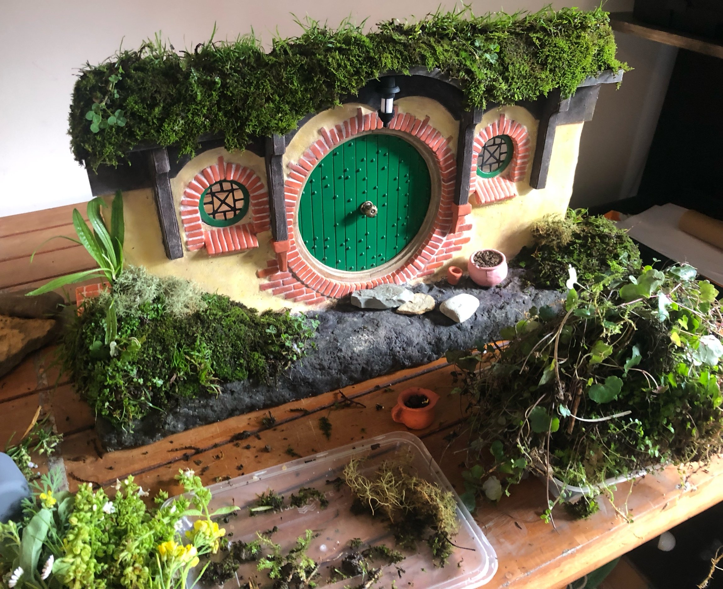 Wiring bigger/heavier plants and pinning them in place in the floristry foam beneath