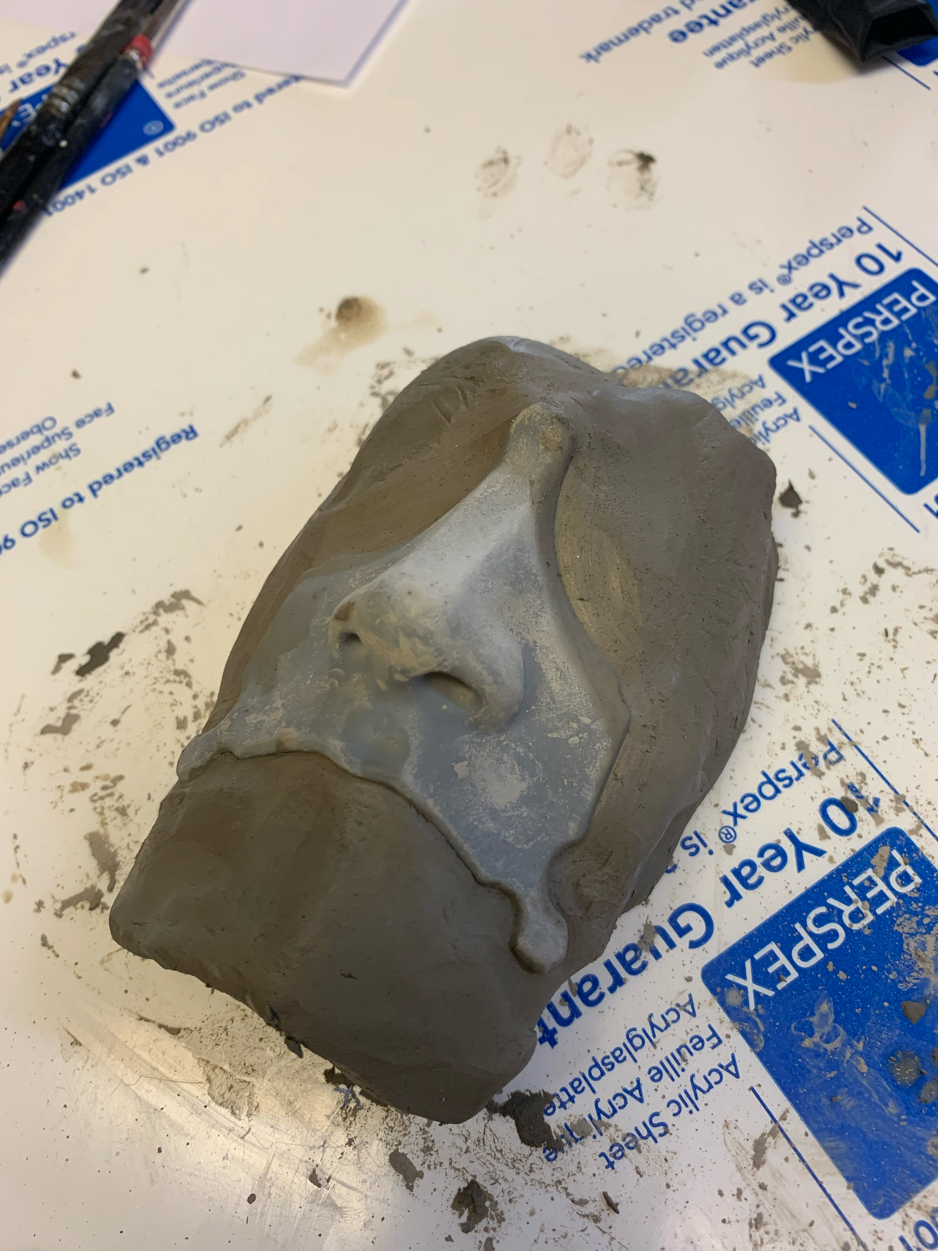 Starting the molding process by building up a clay base