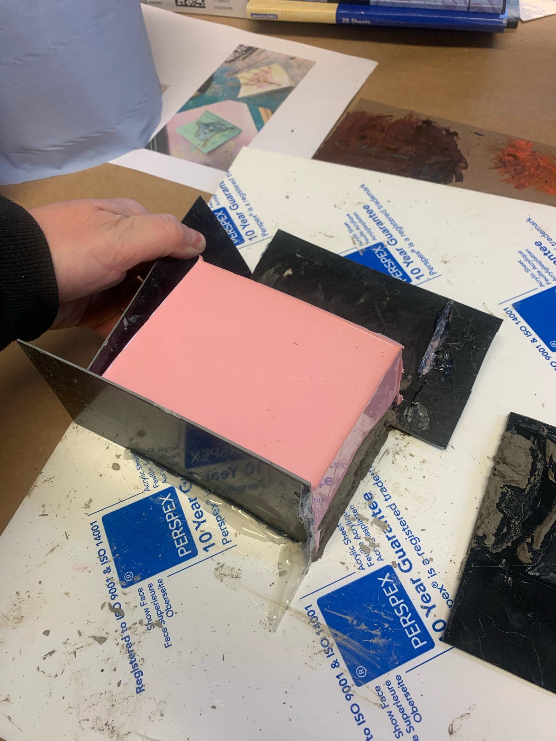 Once cured, releasing the first part of the mold.