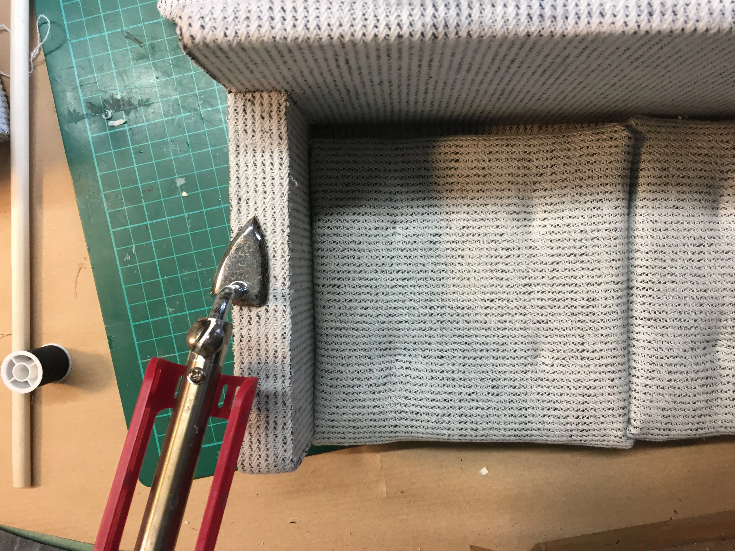 Affixing the side strips with glue and heat to seal the edges