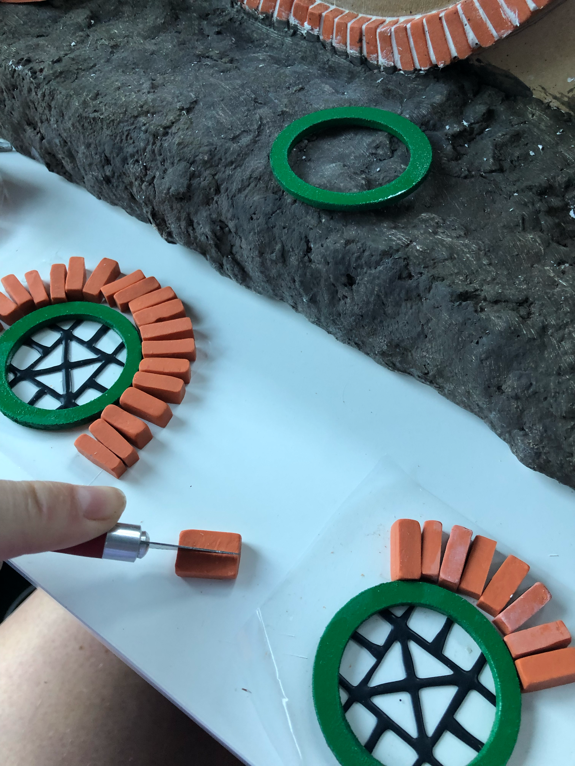 Using faux leading, I drew on a couple pieces of acetate to create the window pattern. I then glued these to the frames. Then started figuring out the brick surrounds