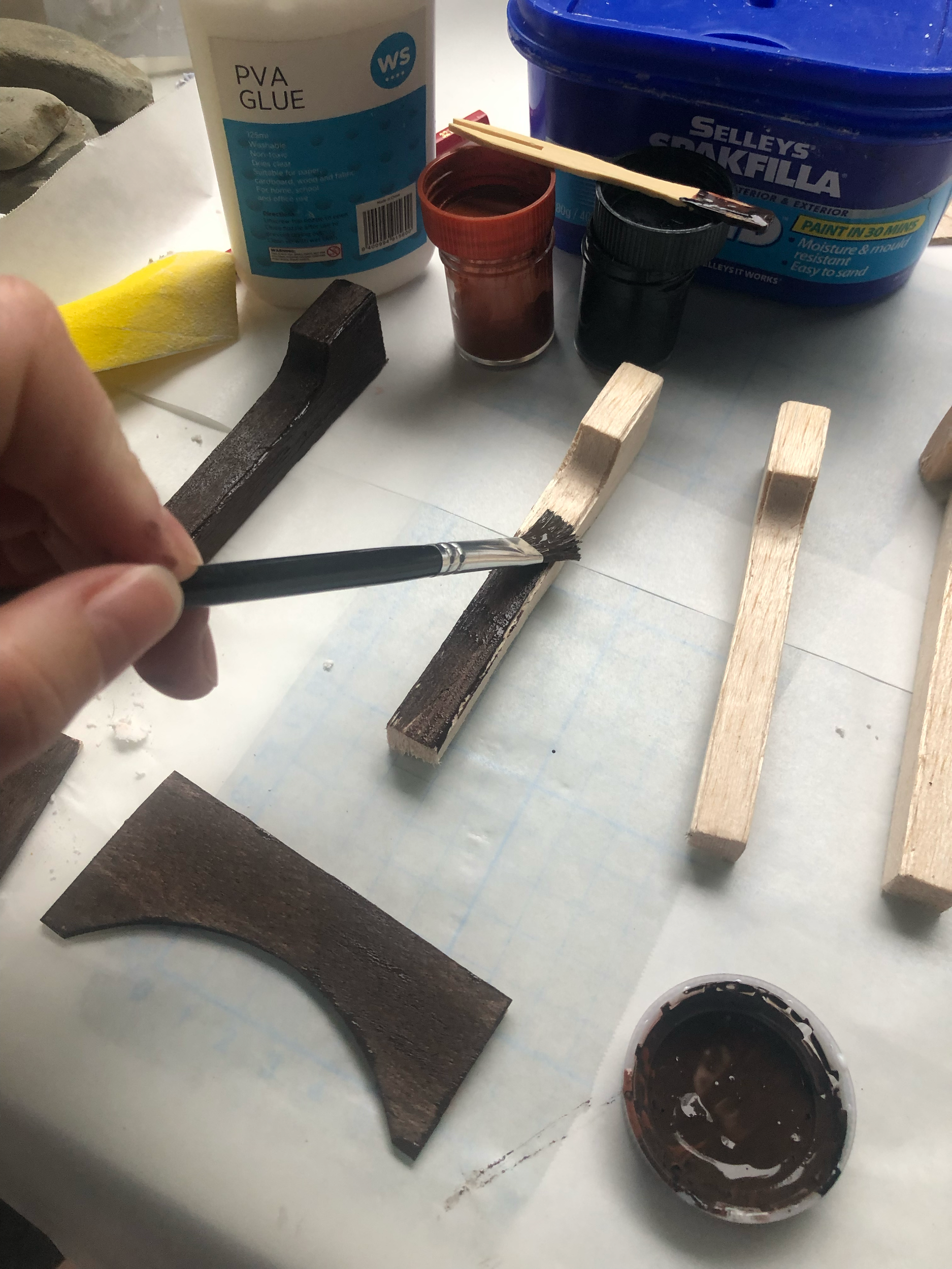 Painting the wood base colour. I ended up carving a semi-circular piece from the back of the two central posts so it could sit on top of the bricked round as well as into the plaster wall behind. I’ve very curious how the actual set was made!