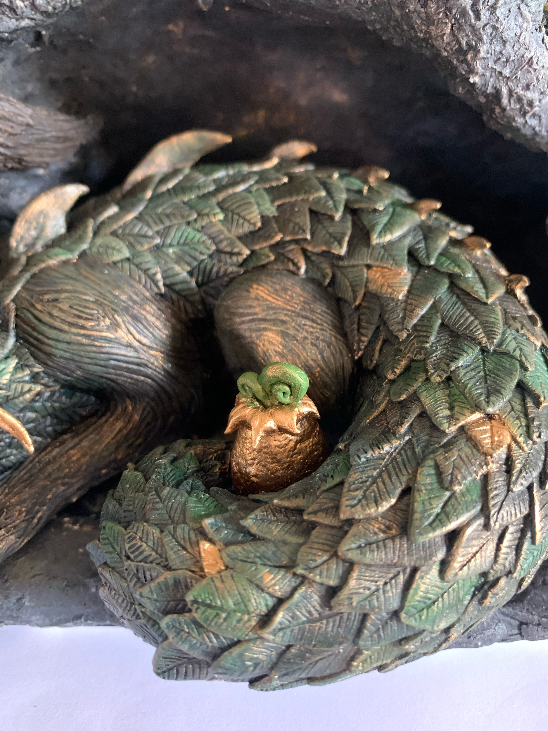I sculpted each individual leaf scale and carved a wood texture into the Drake's exposed skin.