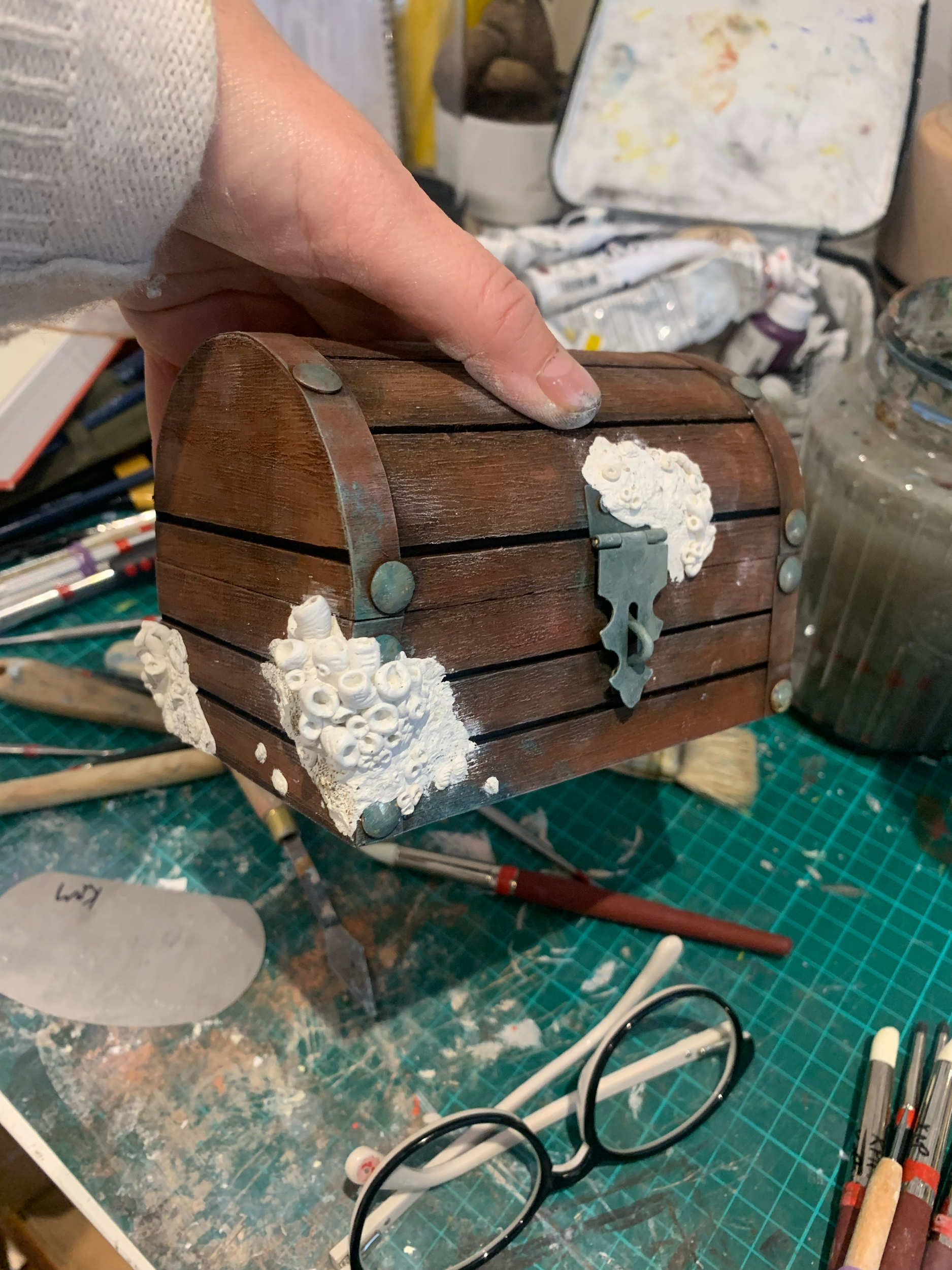 Building up layers of epoxy and sculpting corals