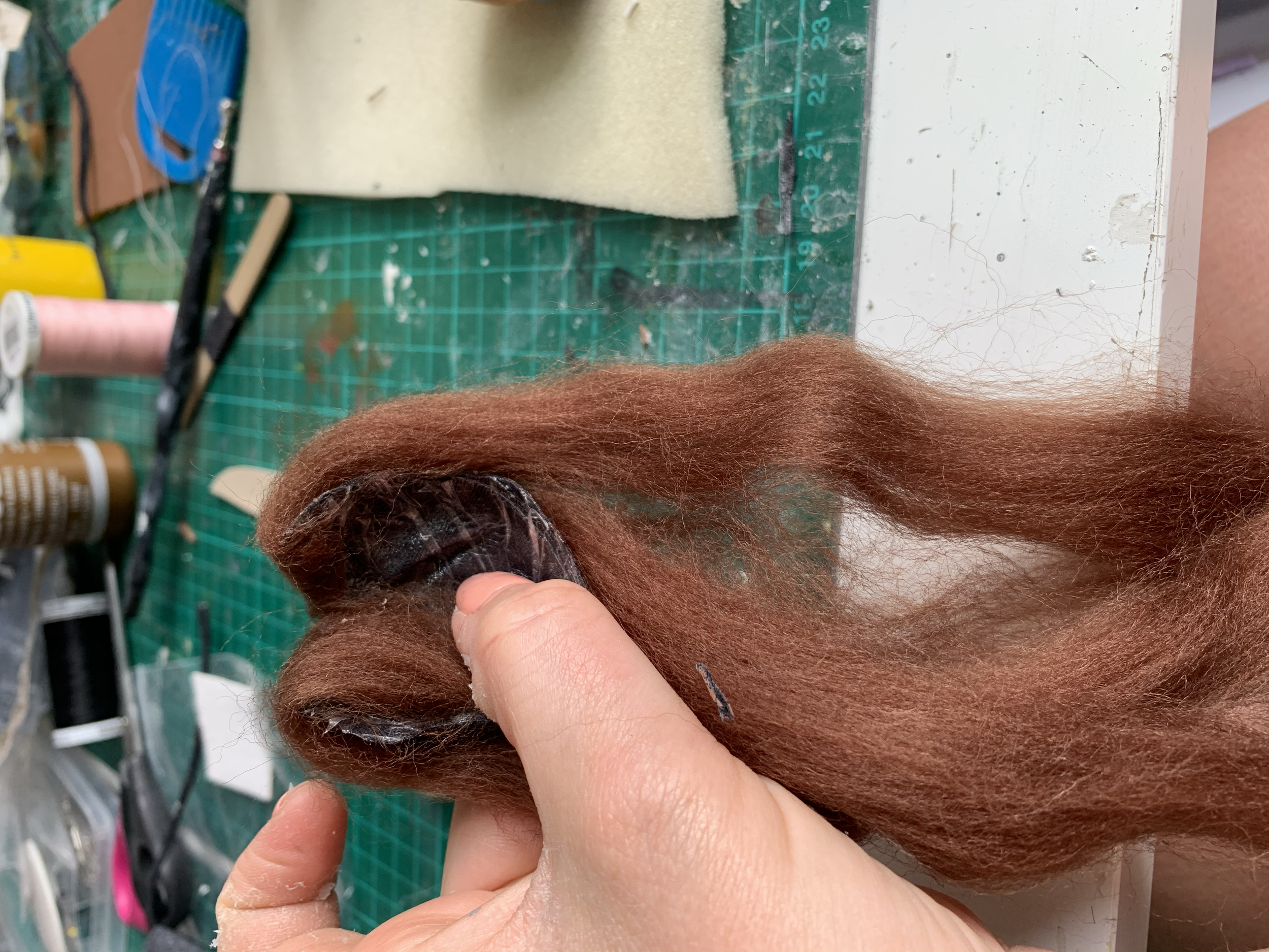 Wig cap and wig construction, from black fabric and auburn roving wool