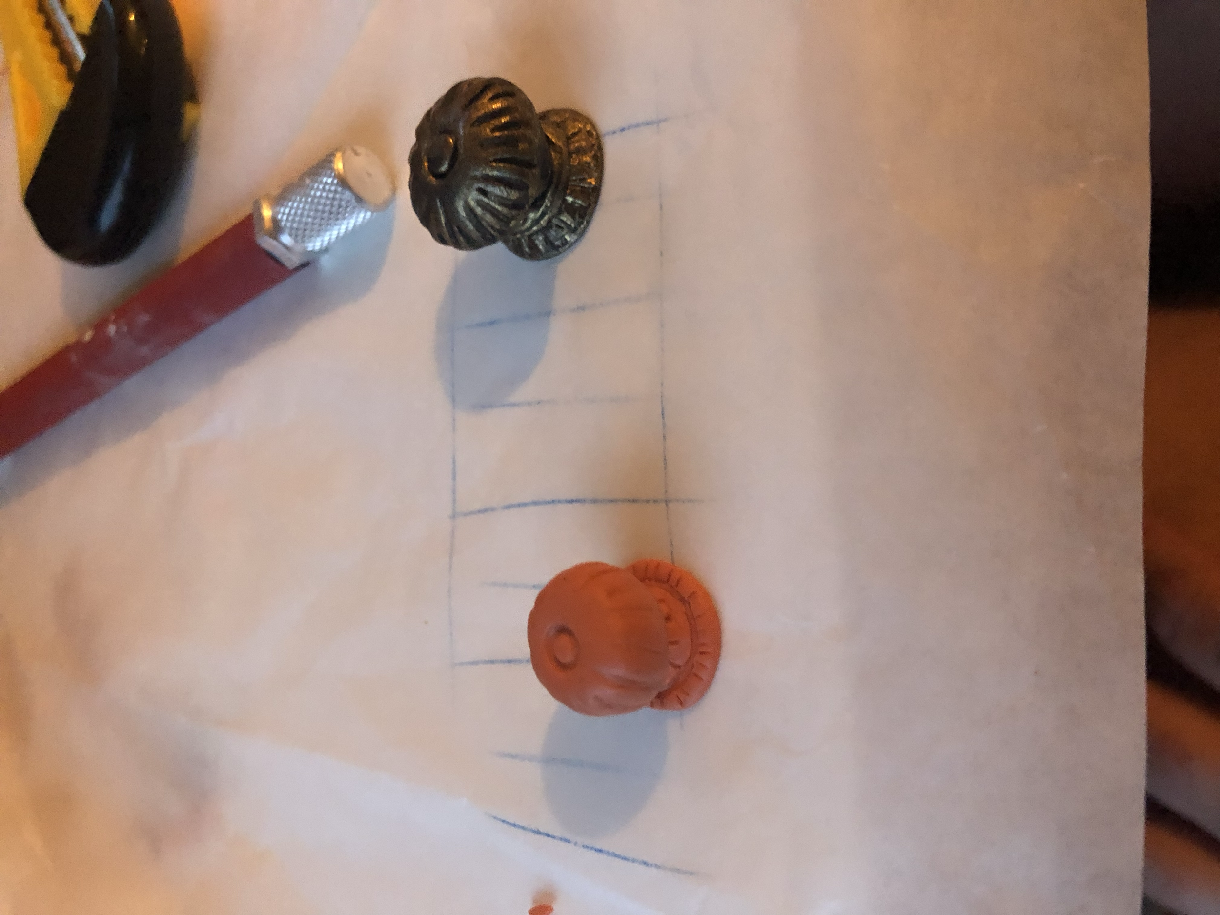 I decided to make a smaller doorknob that looked optically more to scale