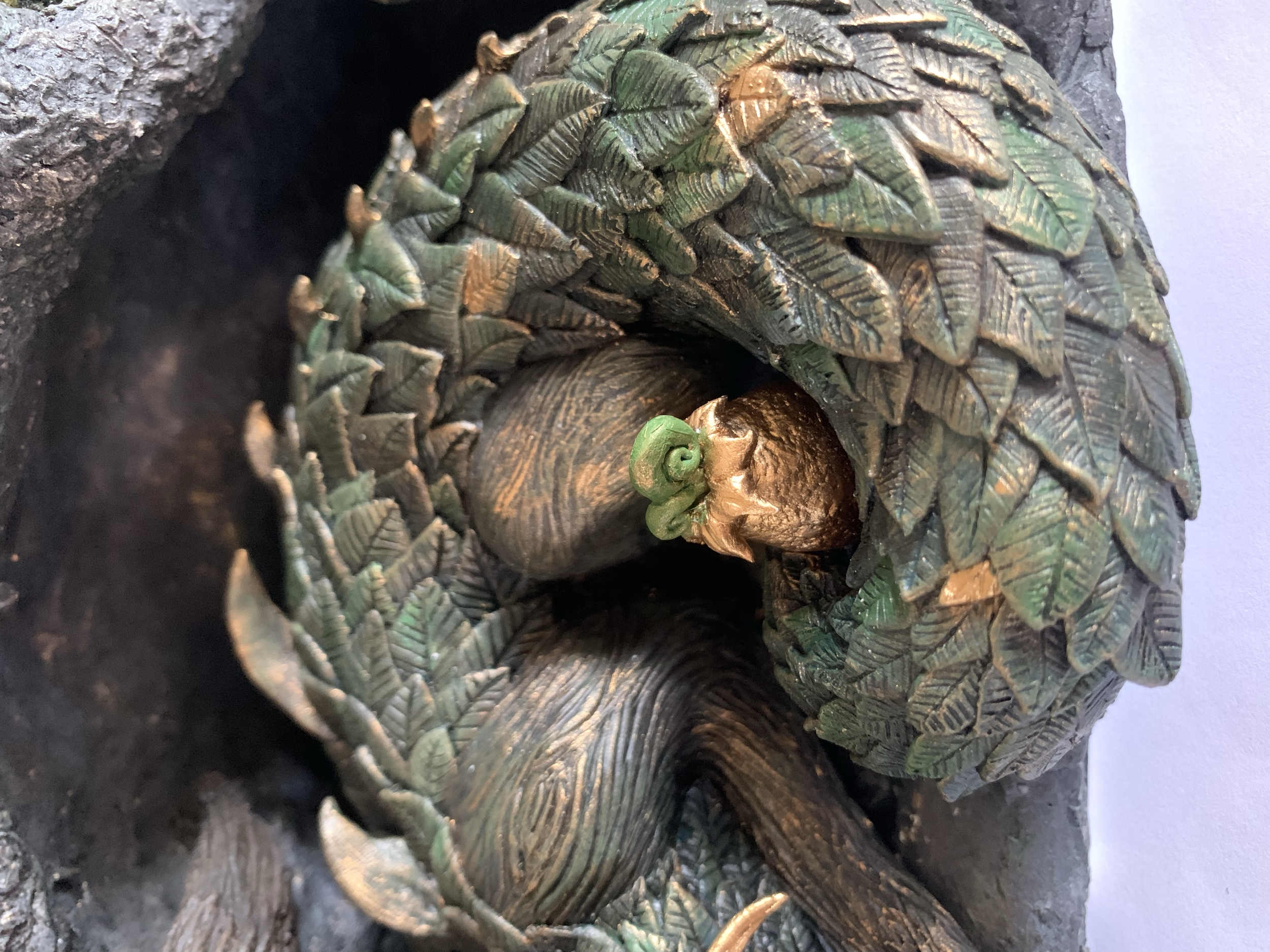 I sculpted each individual leaf scale and carved a wood texture into the Drake's exposed skin.