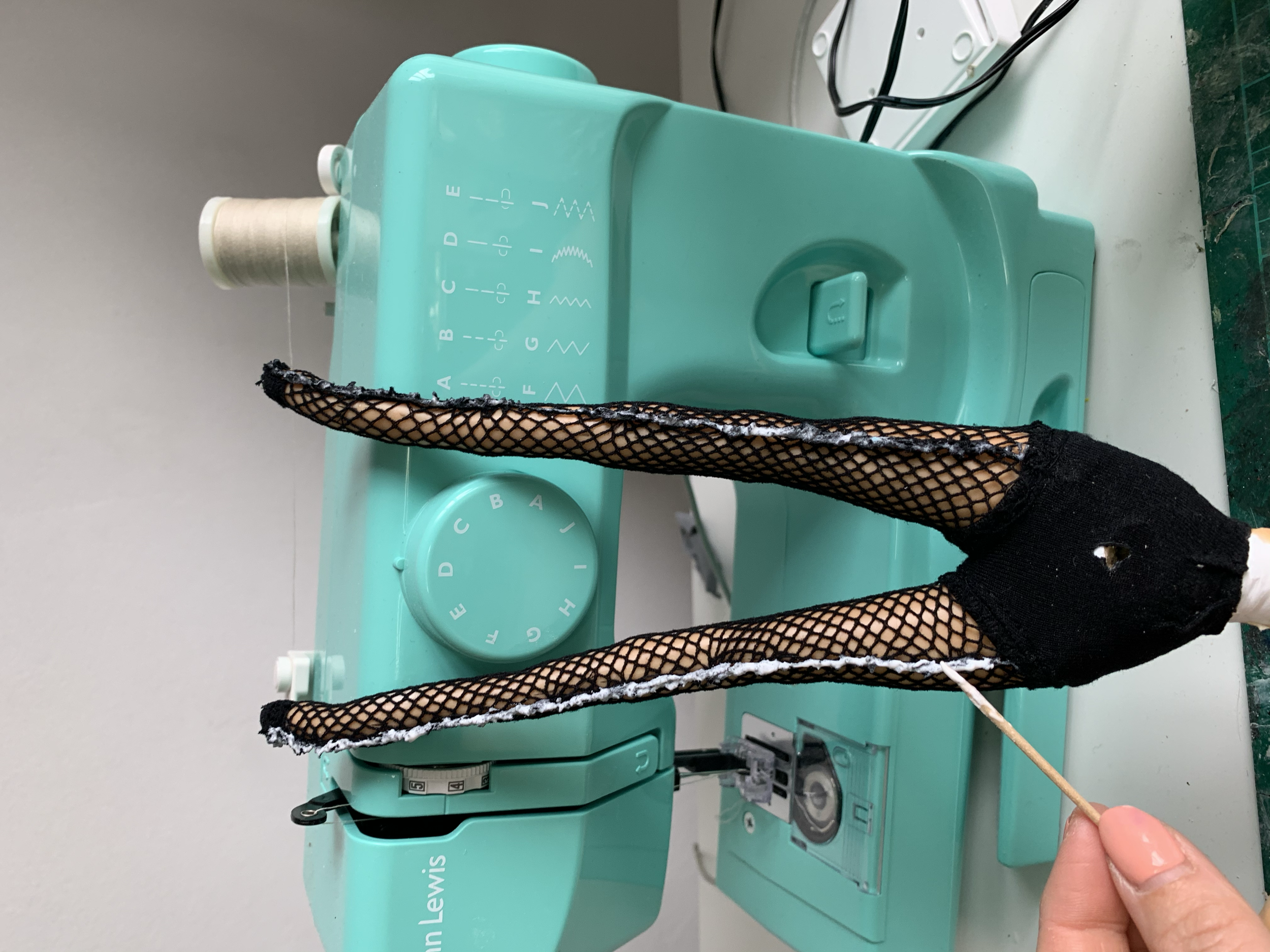 After trying to sew the fishnets, I opted with gluing as the sewing wasn’t effective
