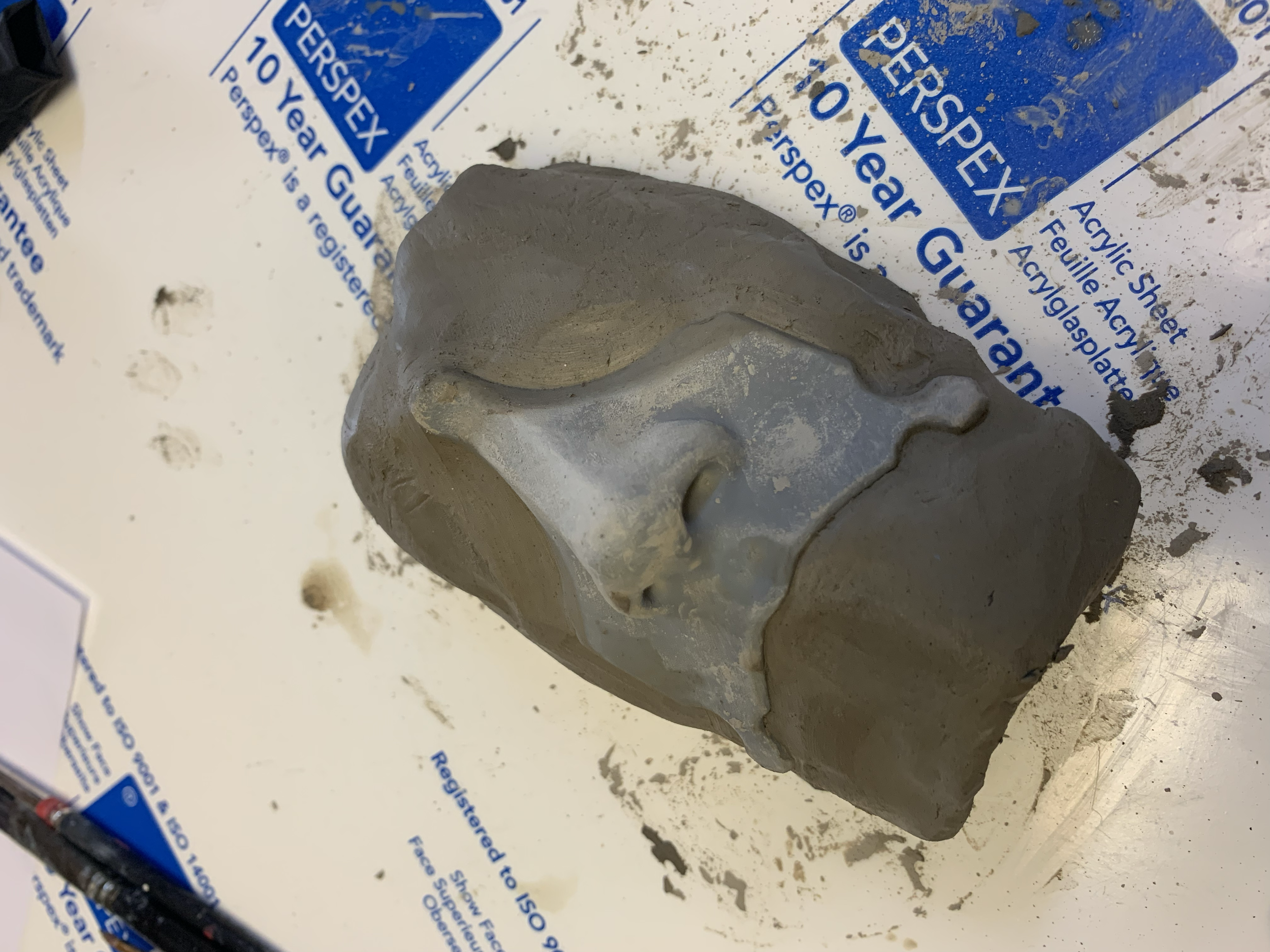 Starting the molding process by building up a clay base