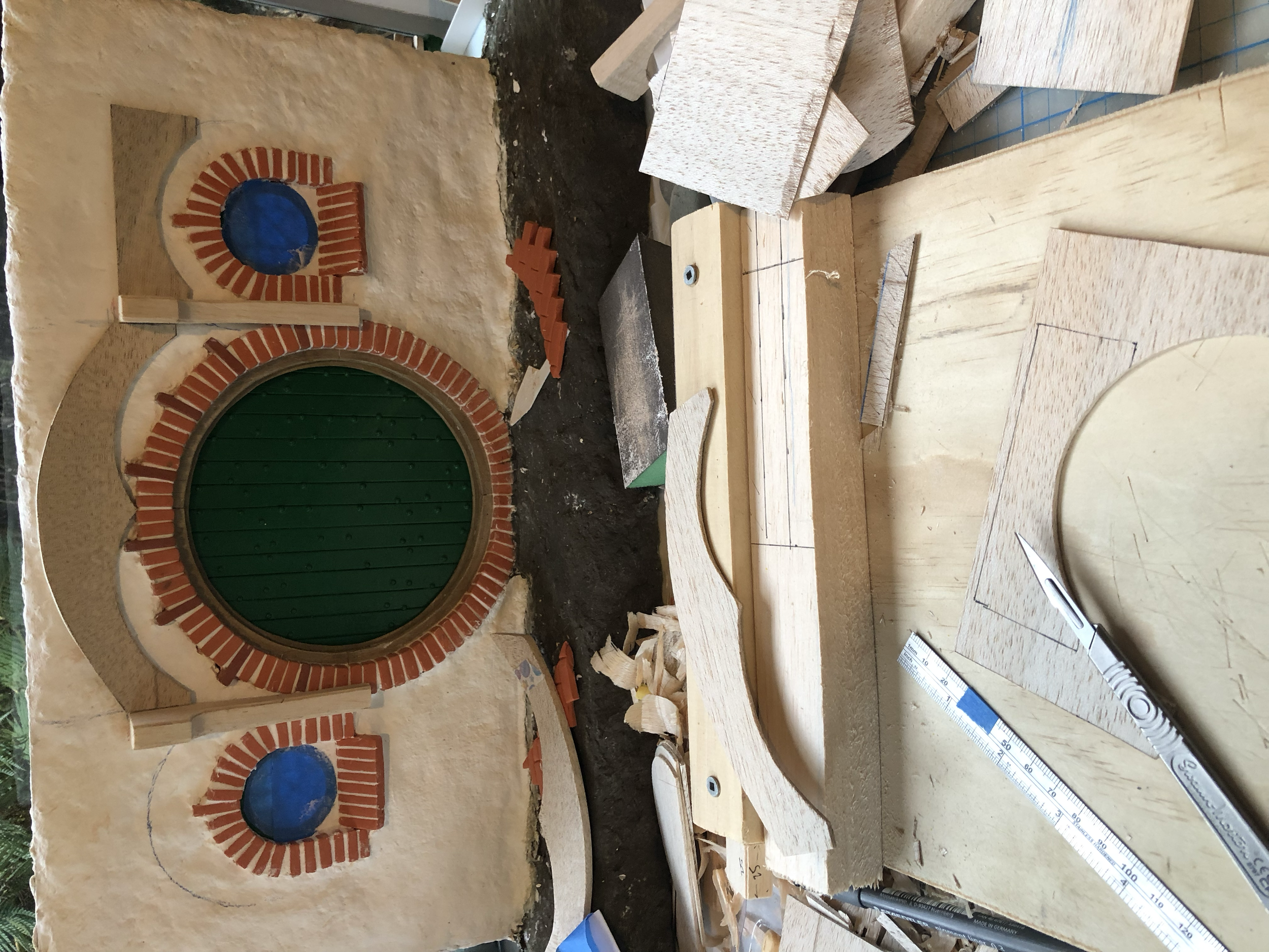 Putting the wood up to test layout. This was one of the hardest steps, figuring out how to sit the central posts on top of the brick but also within the plaster walls behind it, and to be in line with the other wood panel pieces. It took quite a bit