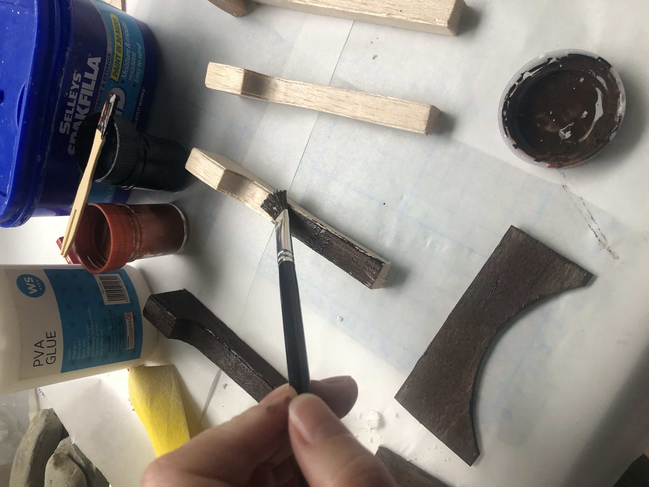 Painting the wood base colour. I ended up carving a semi-circular piece from the back of the two central posts so it could sit on top of the bricked round as well as into the plaster wall behind. I’ve very curious how the actual set was made!