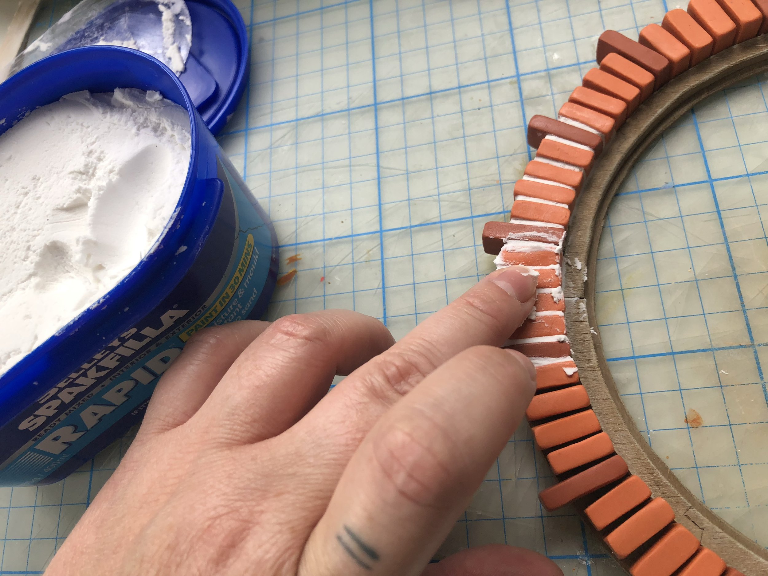 Adding spackle for grout