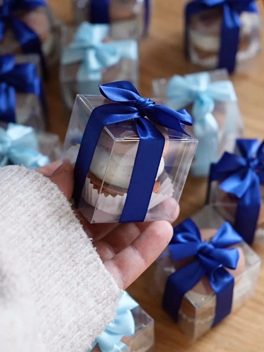 Best seller alert! 🔥 Our macarons in clear boxes are the perfect treat for your guests.

A recent order for a little gentleman&rsquo;s 1st birthday. Finished with blue and light blue ribbons for that perfect touch 💙
DM us, and we&rsquo;ll find the 