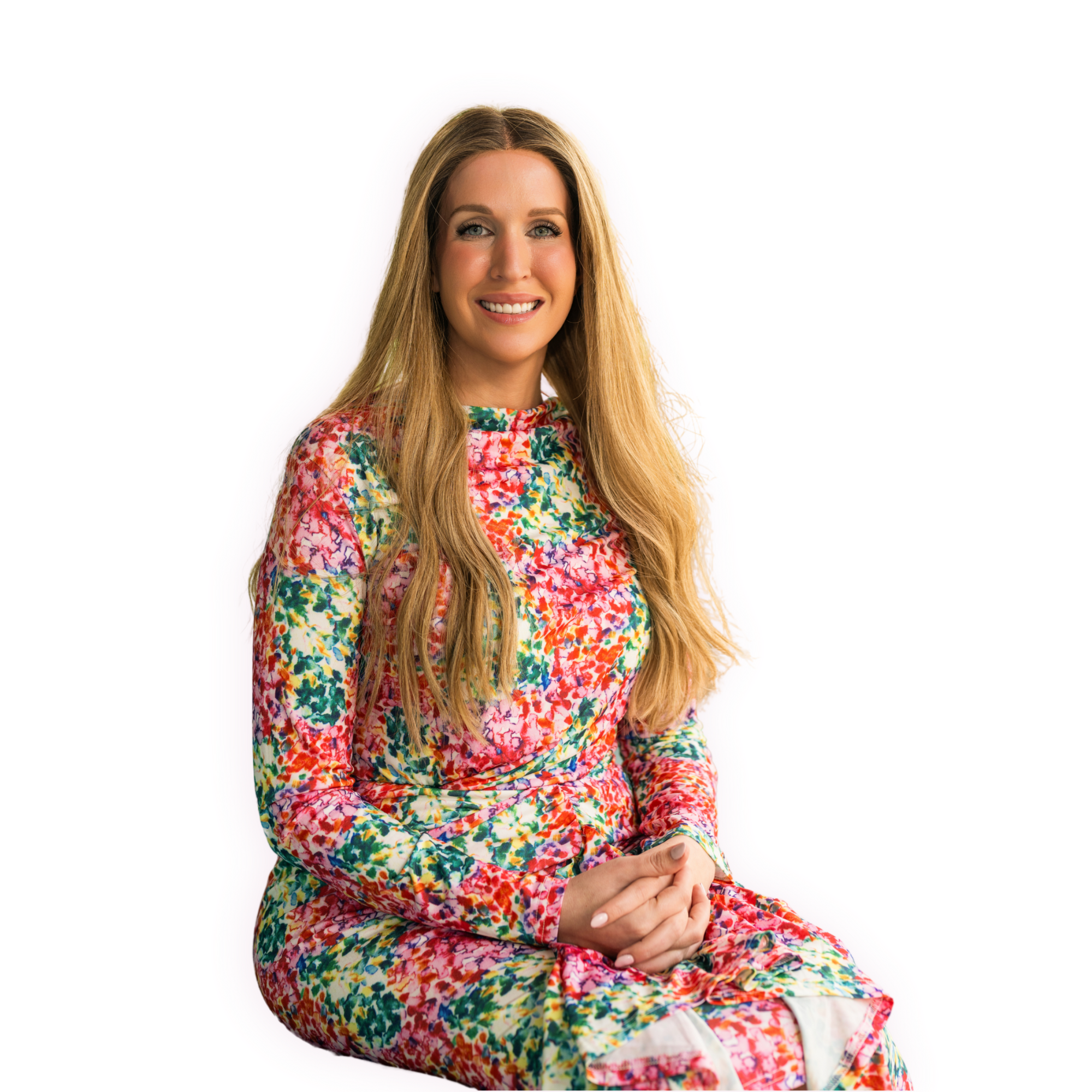 Jewish therapist Lauren Hofstatter with long blonde hair in a floral dress, smiling.