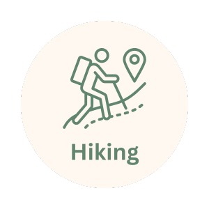 Icon of a person hiking with a backpack on a mountain trail, with a location pin and the word 'Hiking' underneath.