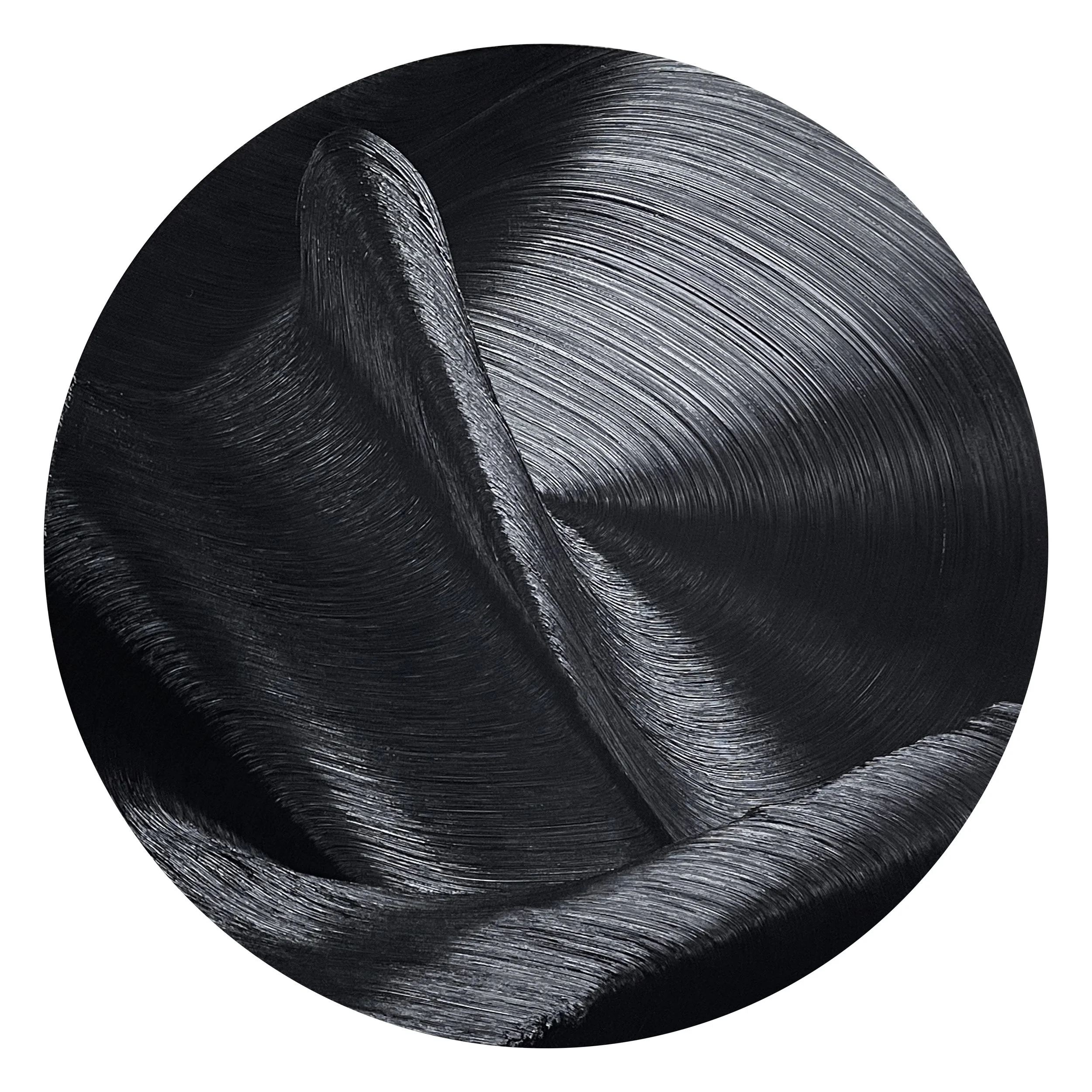 Close-up of a black, textured, metallic sphere with curved grooves.