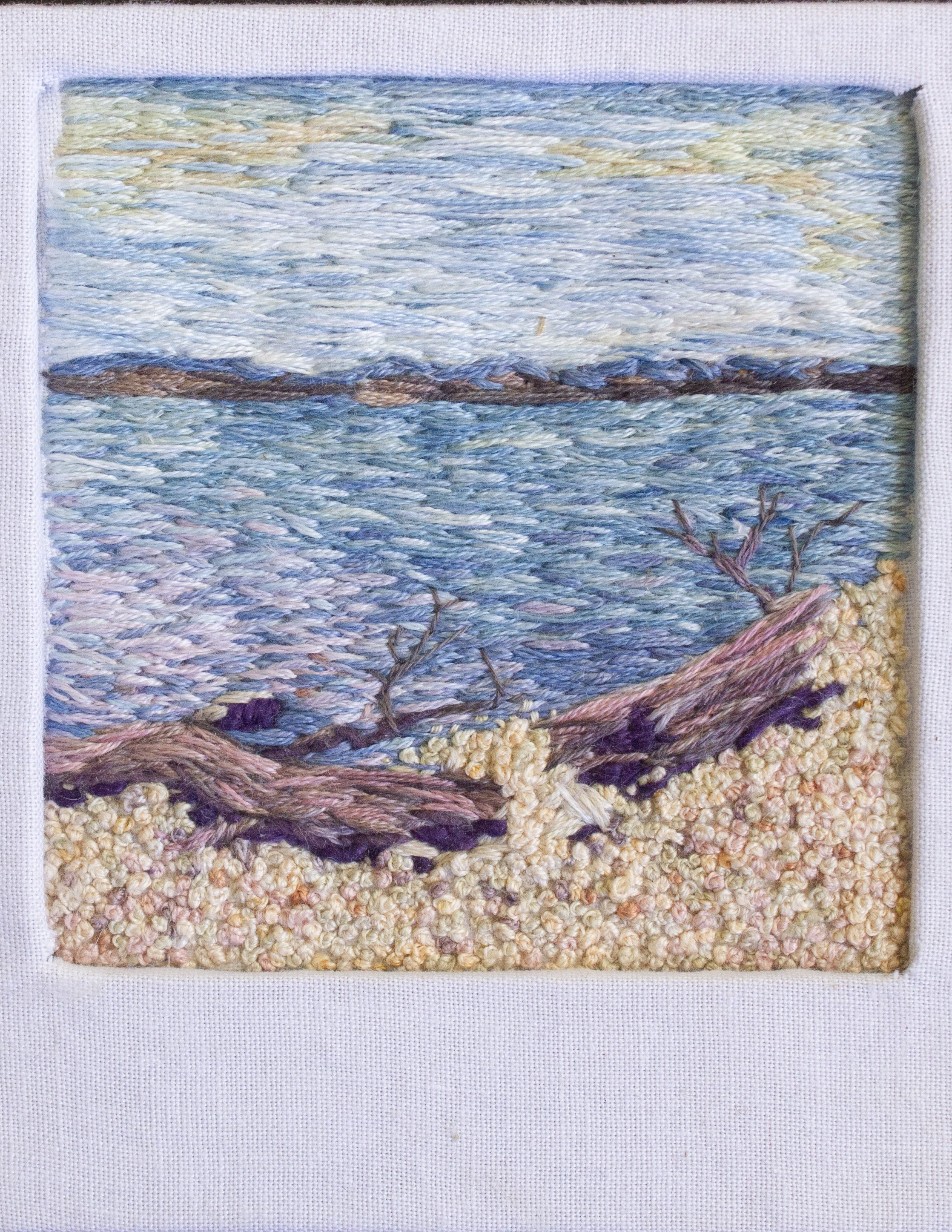 "Scenic Turnoff: Lake Hudson," Cotton fabric, cotton embroidery floss, book board. Natural Dyes including: indigo, coreopsis, cochineal, gallnut, and iron modifiers. 3.5" x 4" x .25", 2024