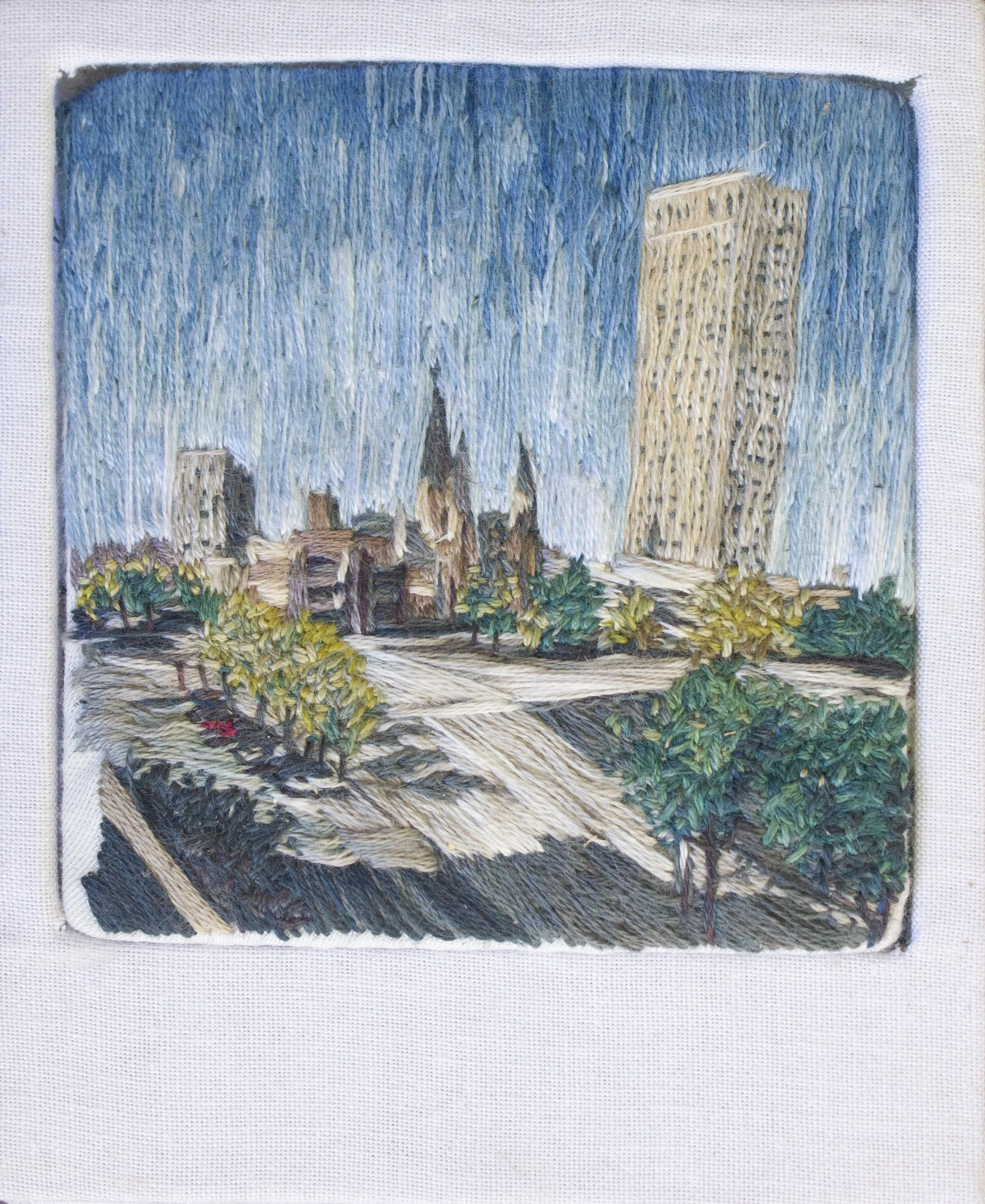 "Downtown Observation Deck: Tulsa," Cotton fabric, cotton, silk, and wool embroidery floss, book board. Natural Dyes including: indigo, weld, black walnut, myrobalan, gallnut, and iron modifiers. 3.5" x 4" x .25", 2025