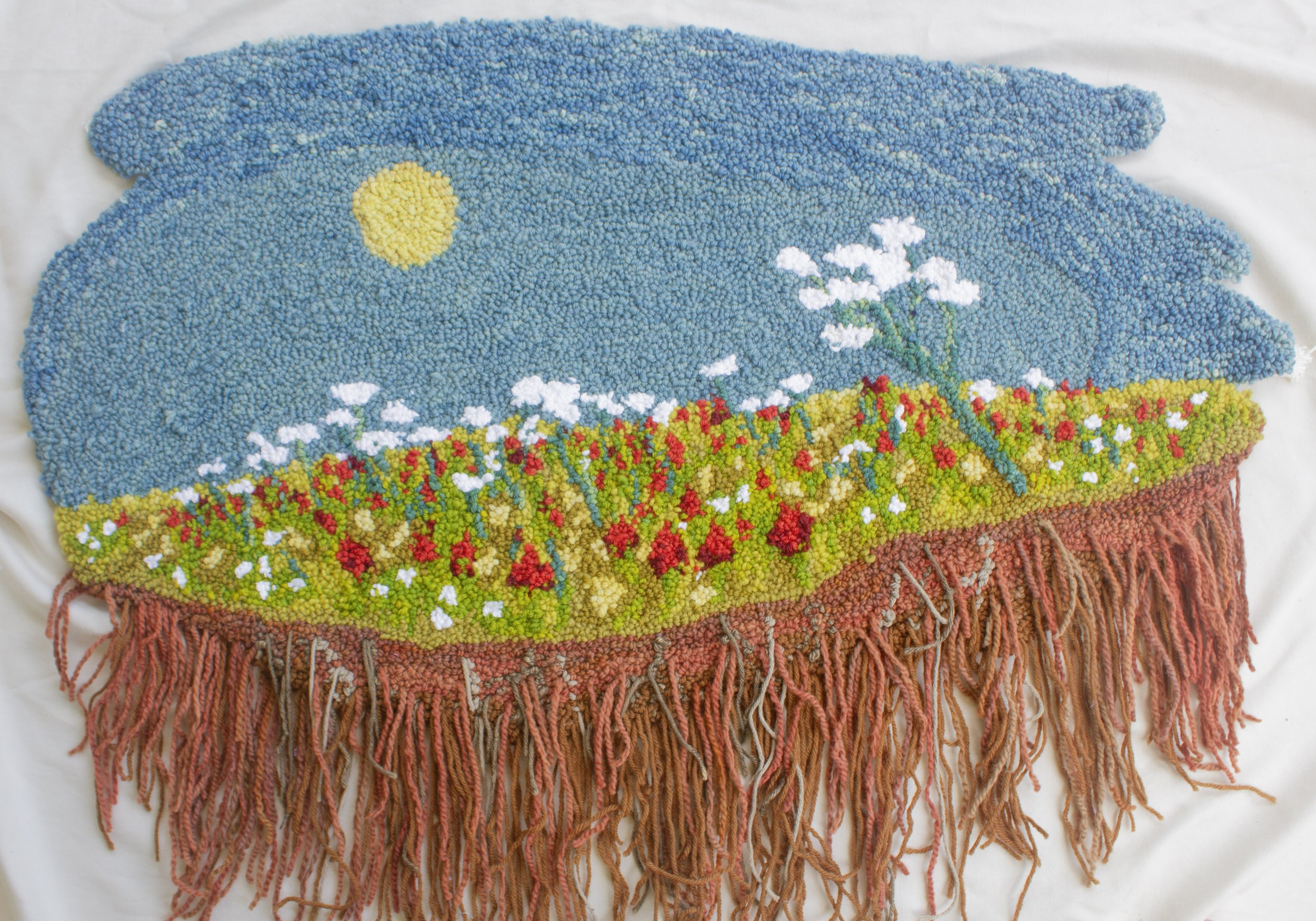 "Imagined Landscapes: Landlocked," Cotton fabric, wool and cotton yarn. Natural Dyes including indigo, weld, lac, Osage orange, goldenrod, madder, black walnut 33"x 30"x .5", 2025