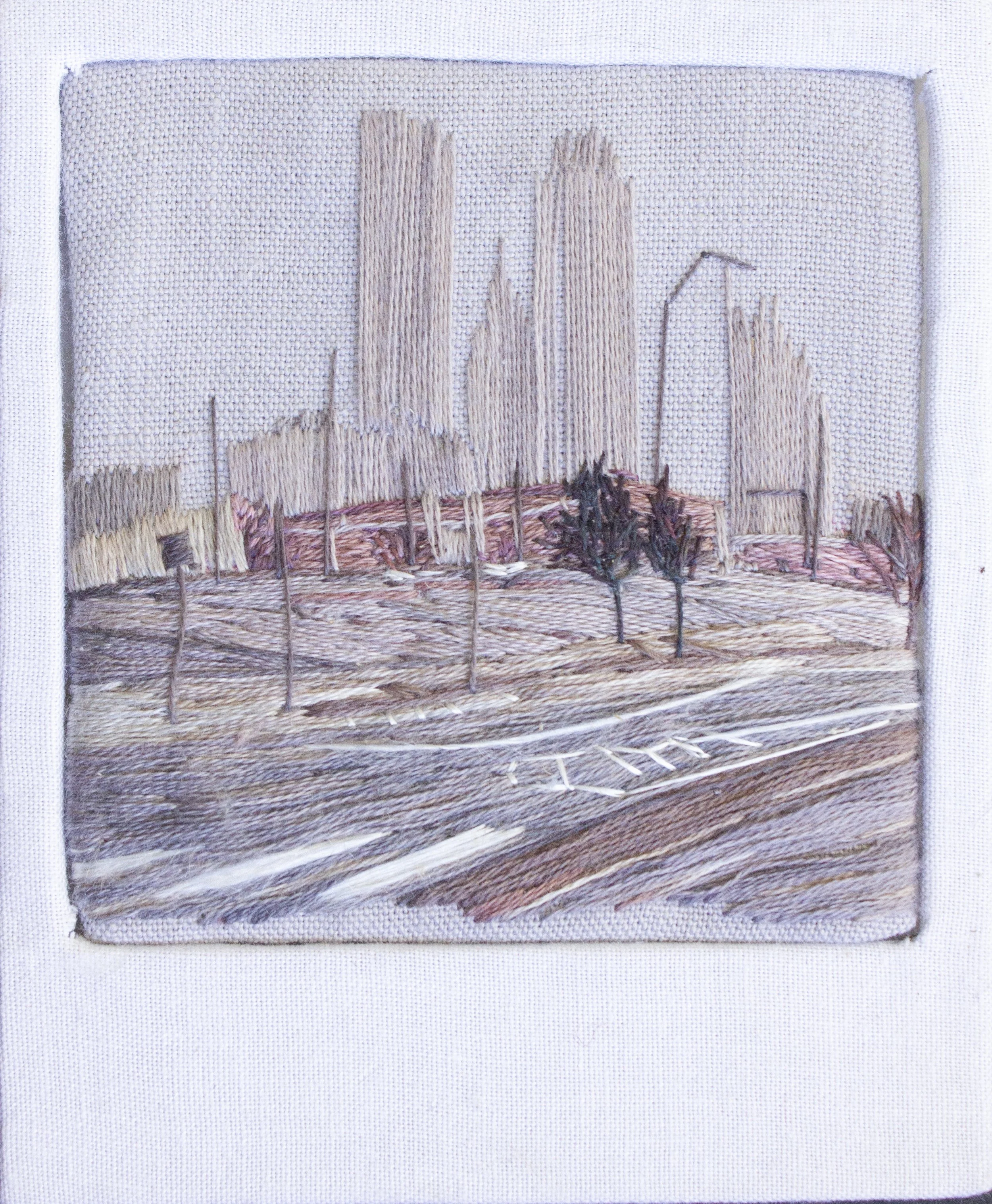 "Fog Downtown: Tulsa," 2025, Cotton fabric, cotton and silk embroidery floss, book board. Natural Dyes including: lac, cochineal, madder, indigo, black walnut, and iron modifiers. 3.5" x 4" x .25"
