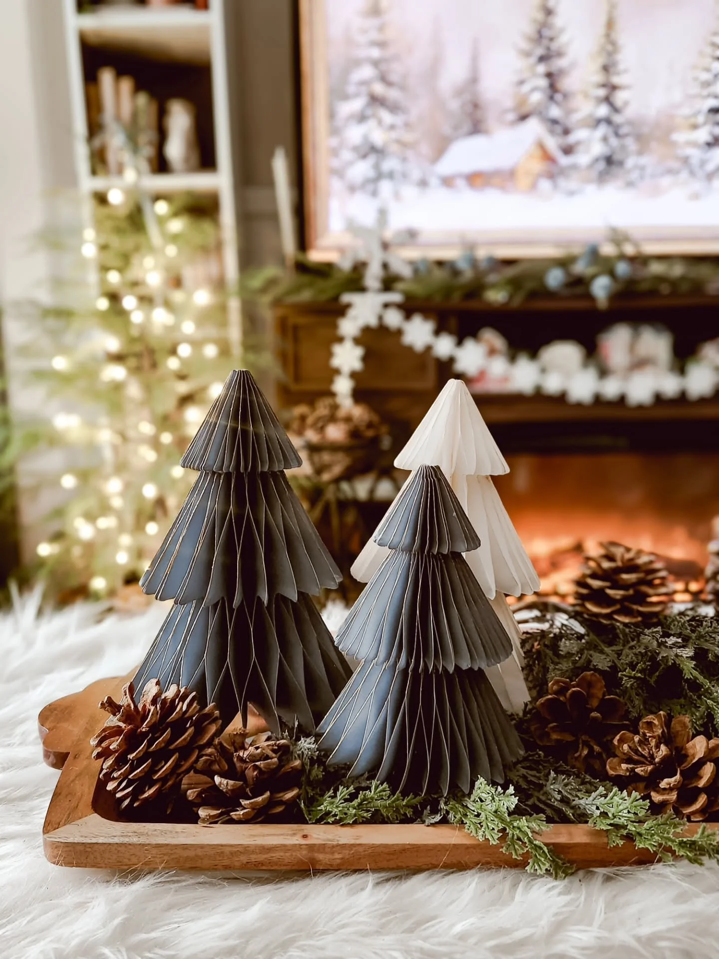 Snow is falling outside, and the house is wrapped in winter warmth inside.

Soft winter blues in the living room, glowing firelight, vintage touches in the dining room, and layers of cozy textures in every corner.

Days like today remind me why I lov