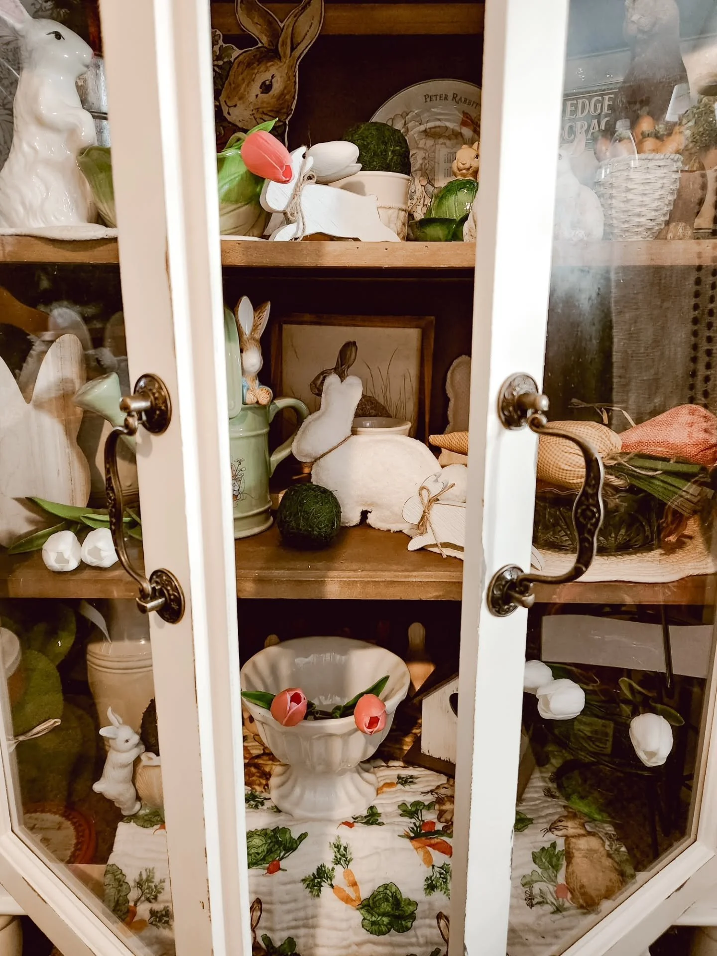 I think every house needs a little spring cabinet.

Somewhere to tuck the bunnies, stack the dishes, and pretend tulips are blooming outside already.

This one might be my favorite corner of the house right now. 🐇🌷