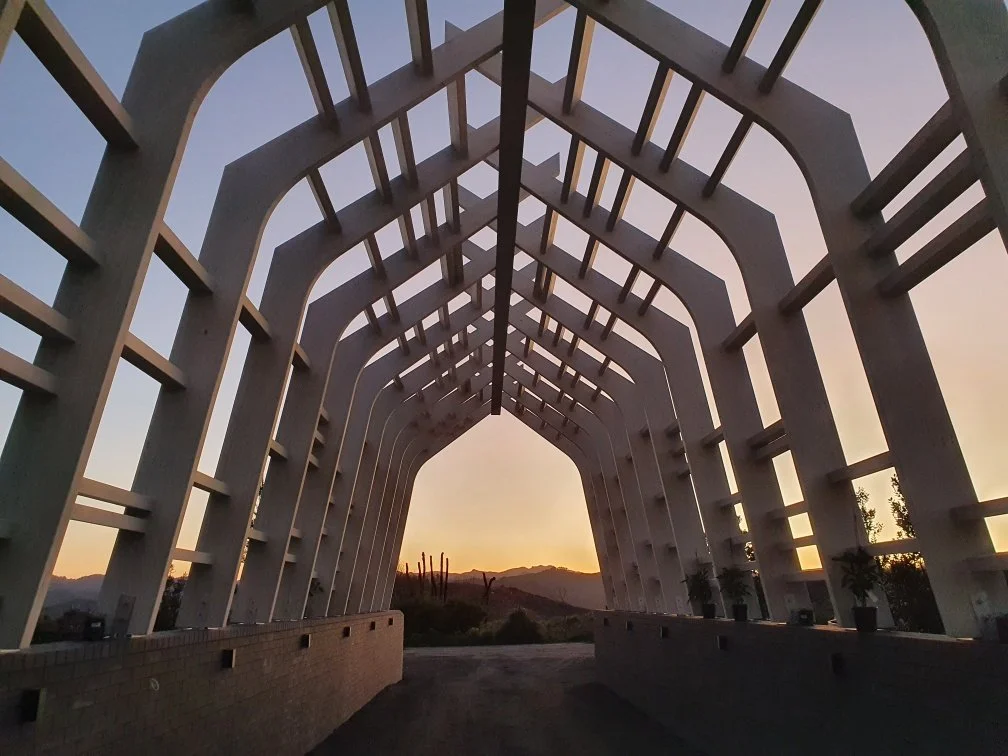 A visually stunning custom glulam timber gateway at a New Zealand beachside retreat.