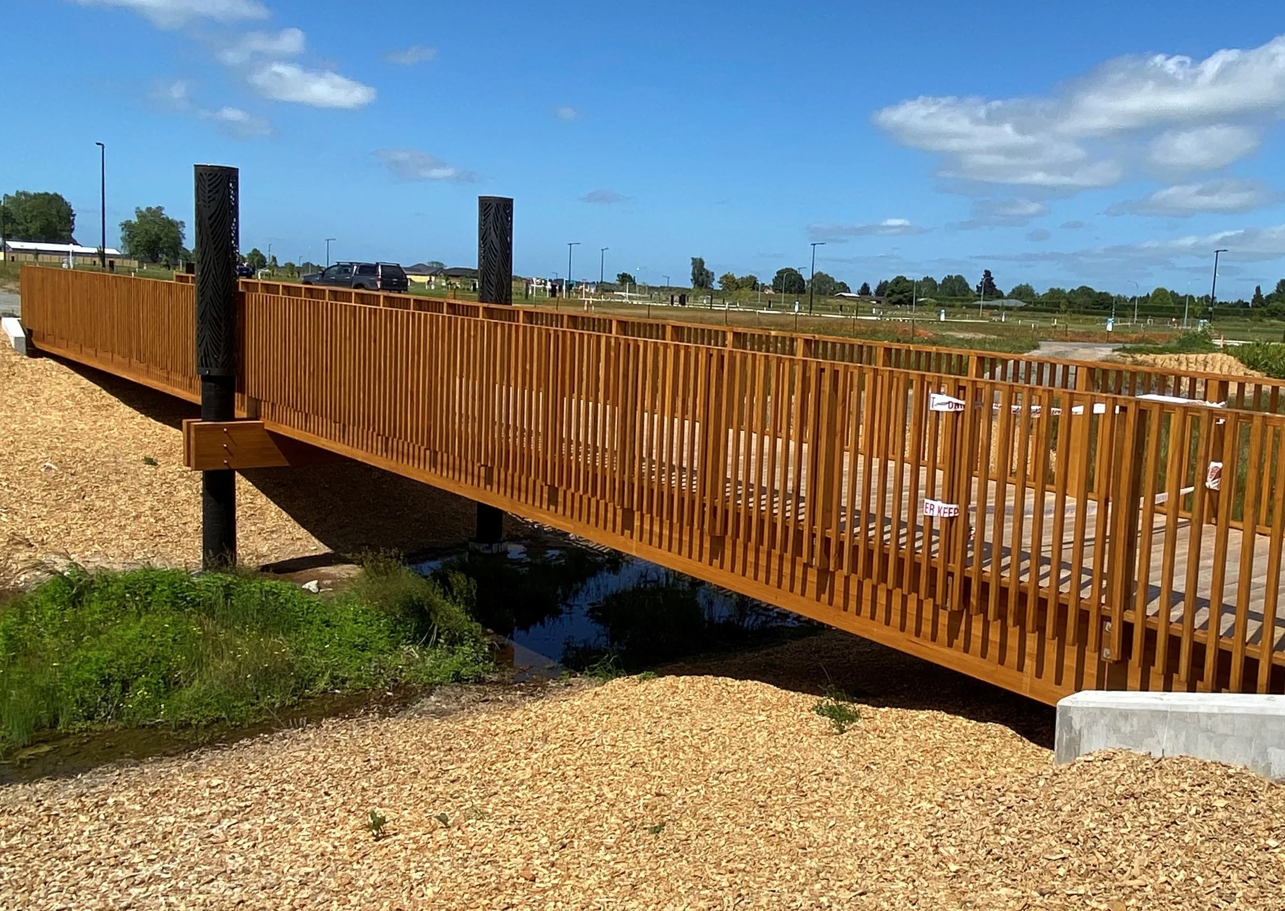 A custom made glulam timber bridge at Bridleways Estate.