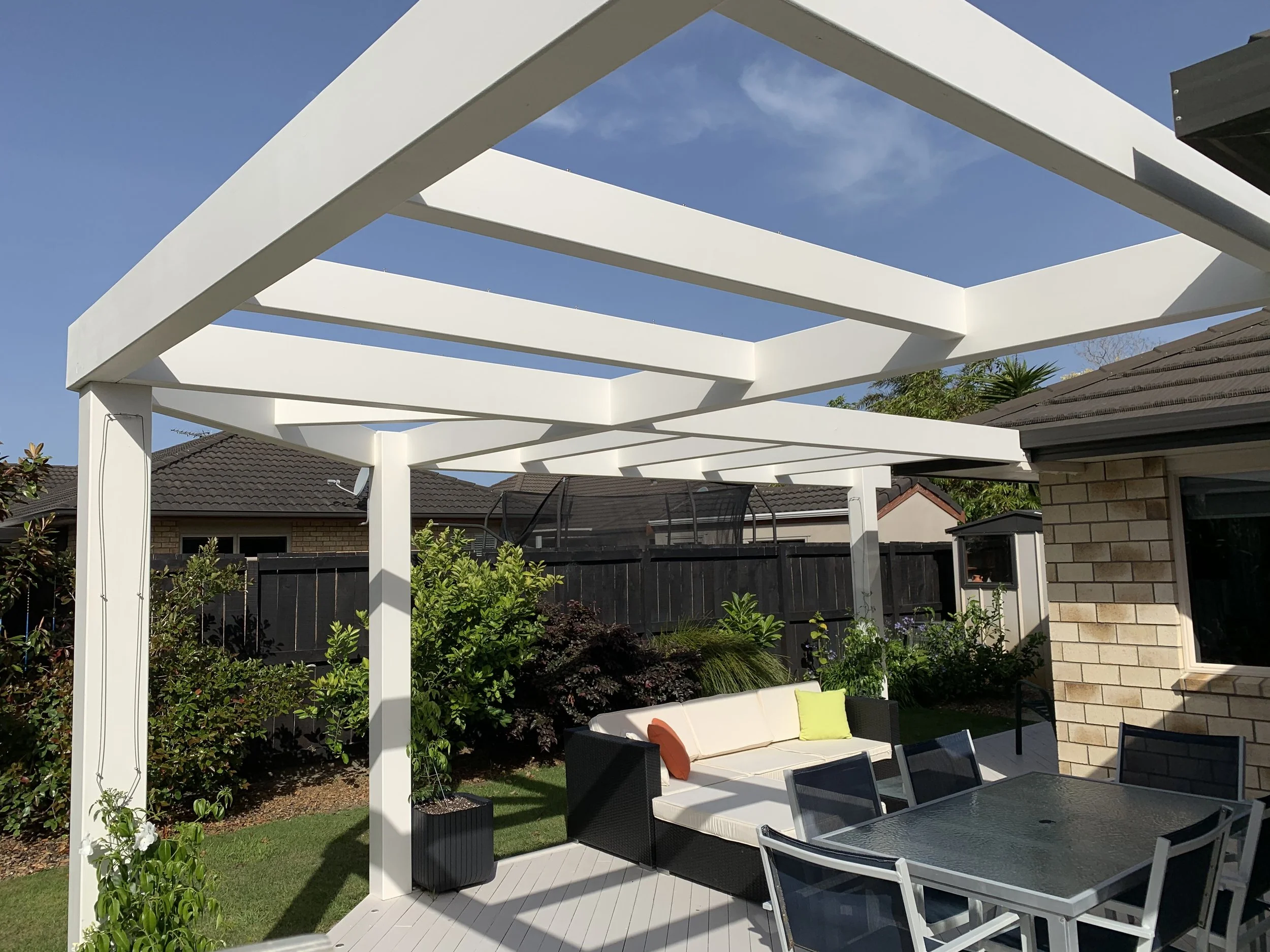 A custom-made glue laminated timber pergola made by Laminated Beams.