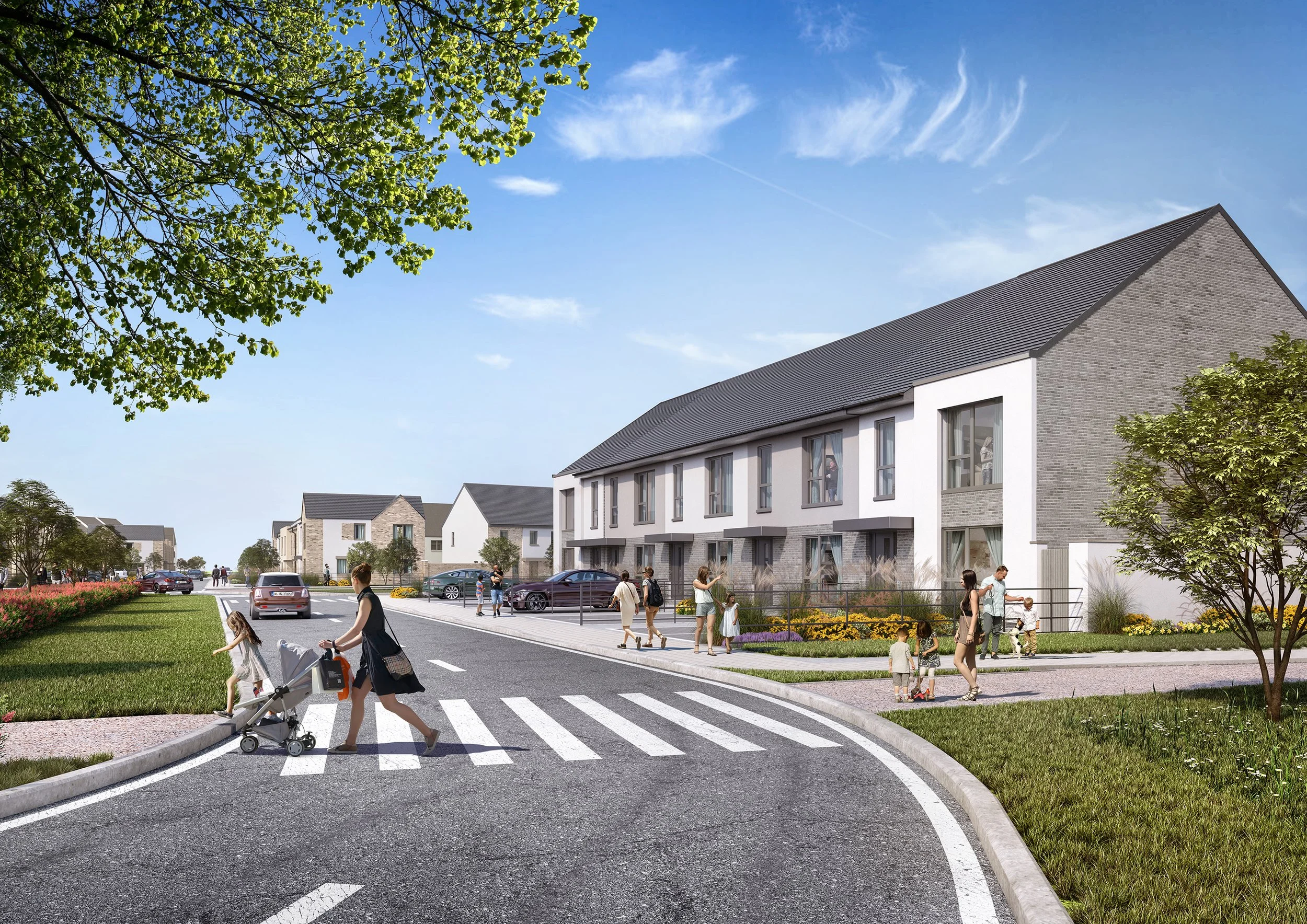 A modern residential neighborhood with townhouses, people walking and children playing on sidewalks, a woman pushing a stroller crossing the street, parked cars, trees, grassy areas, and a clear blue sky.