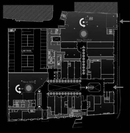Floor plan of a building with labeled areas including a car park, multiple rooms, staircases, and directional arrows.