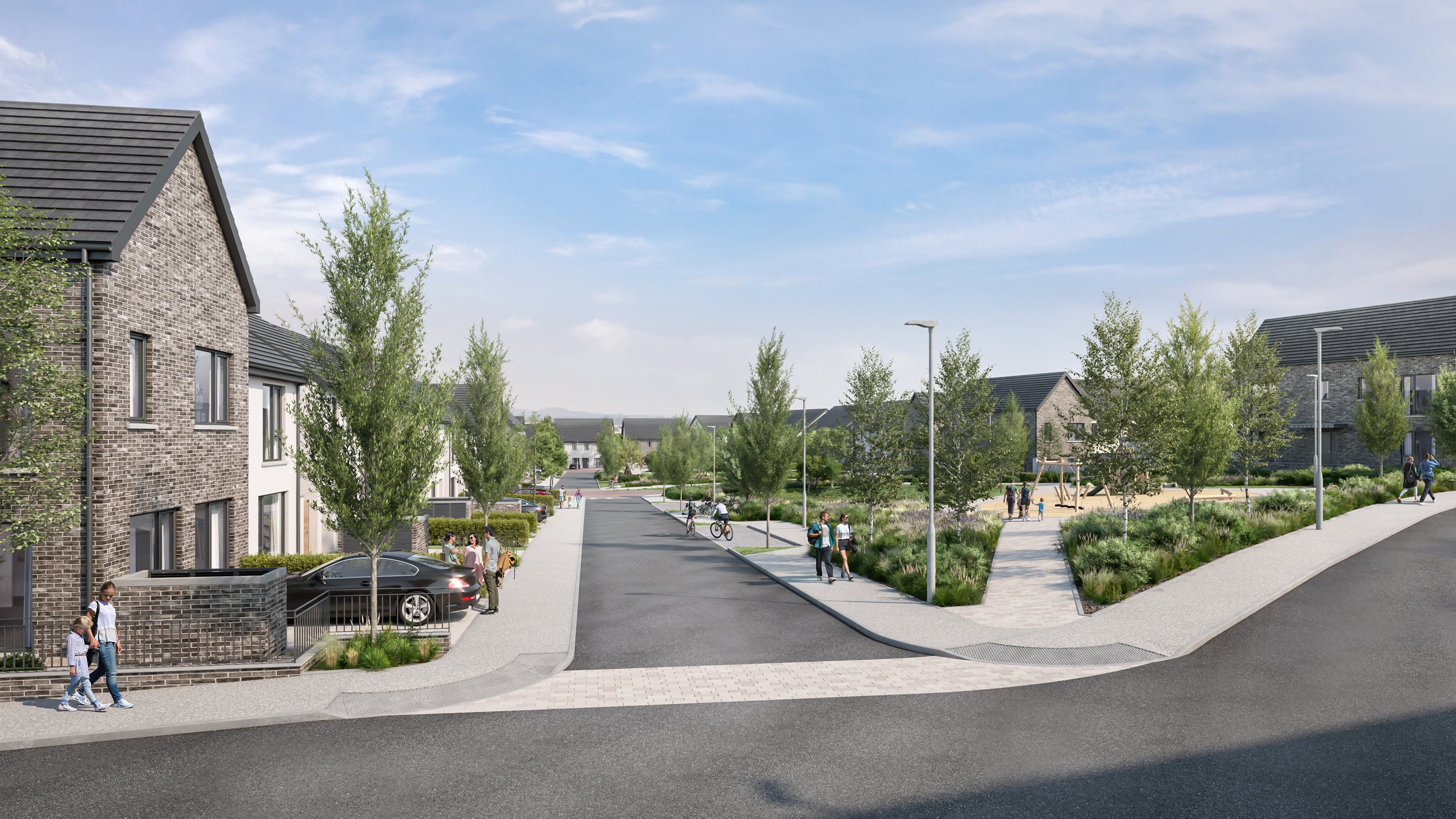 Residential neighborhood street with newly built houses, parked cars, trees, and residents walking and biking on the sidewalks under a partly cloudy sky.