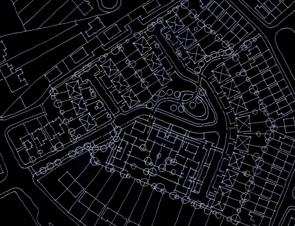 A detailed blueprint or site plan of a residential complex or neighborhood, showing buildings, roads, parking areas, and landscaping features.
