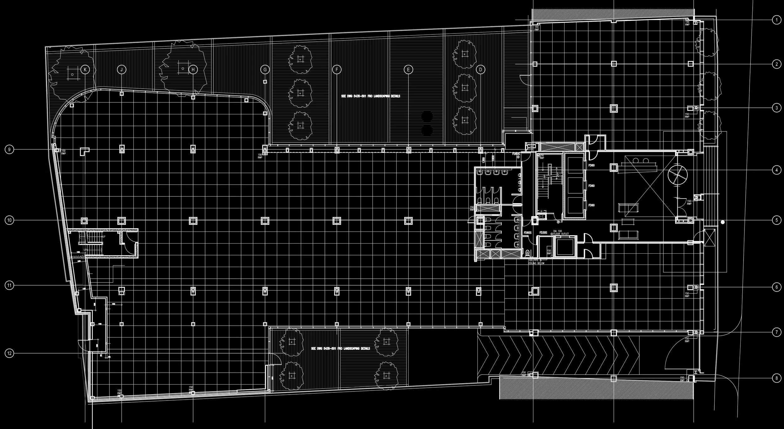 Architectural blueprint of a building floor plan with labeled rooms, trees along the exterior, and a grid layout.