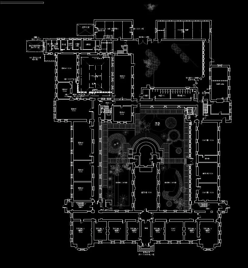 Architectural floor plan of a large building with multiple rooms and courtyards, including offices, lounges, and service areas, on a black background.