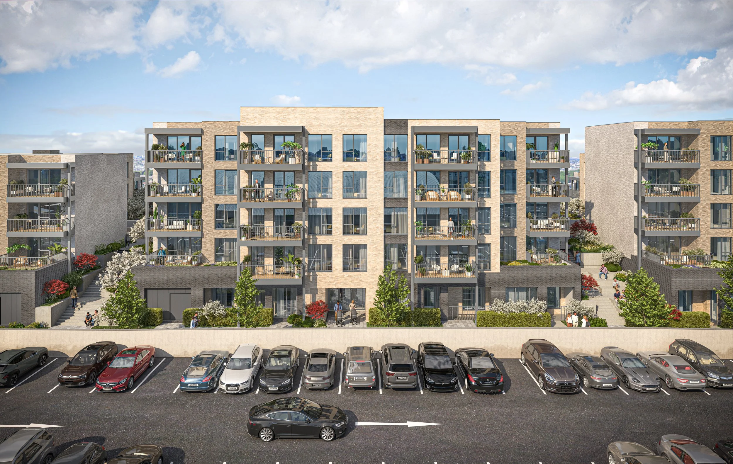 Modern multi-story apartment building with balconies, surrounded by landscaping, with a parking lot in foreground under partly cloudy sky.