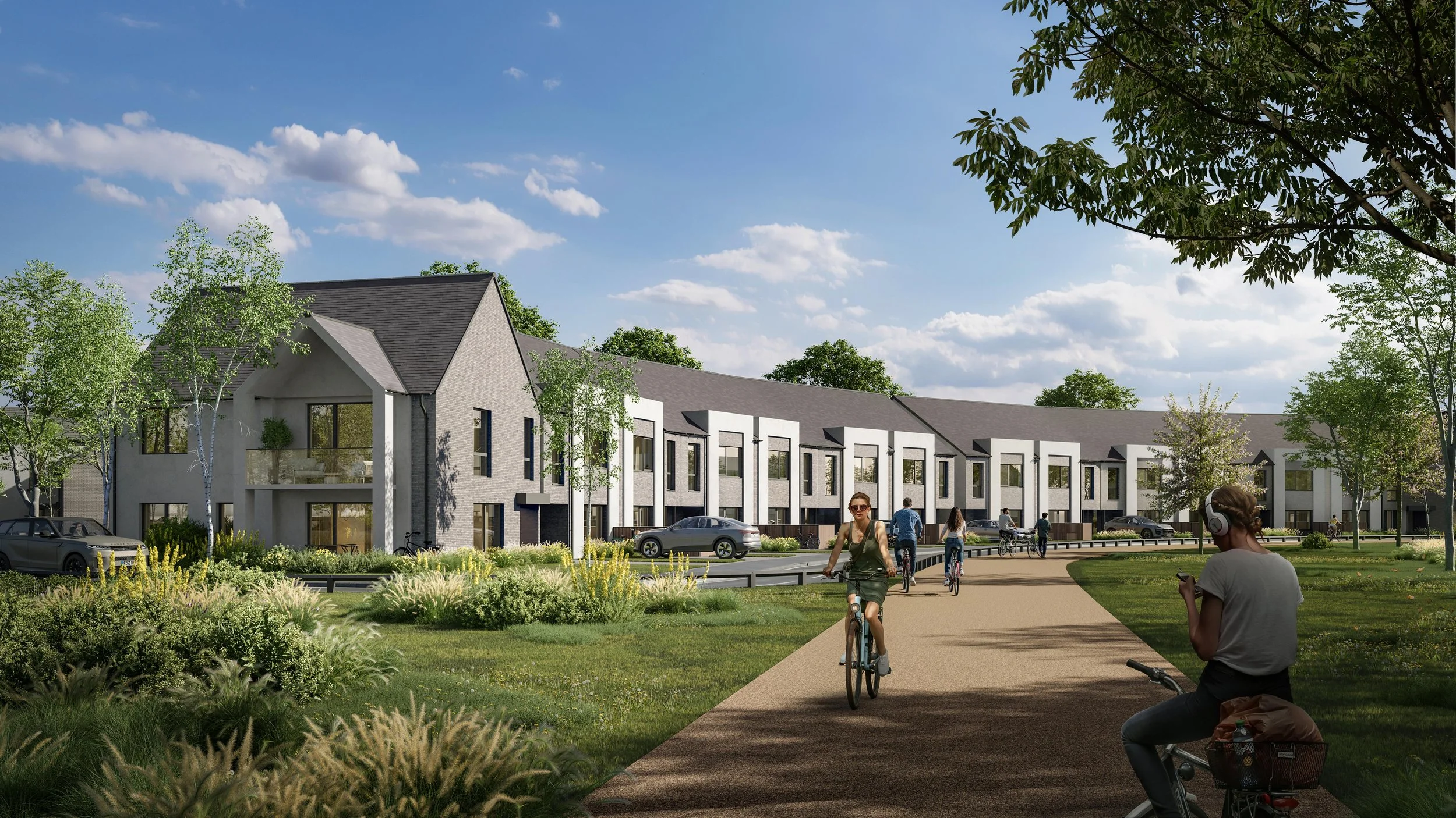 A modern residential community with townhouses, sidewalks, and green spaces. People are biking, walking, and relaxing outdoors on a sunny day with a blue sky and scattered clouds.