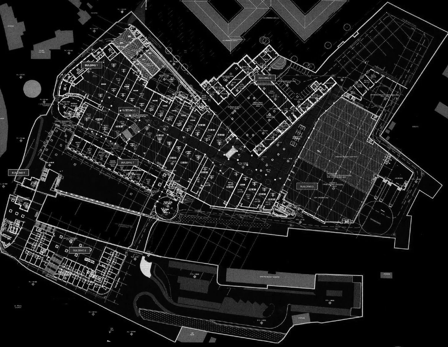 Architectural blueprint of a large building complex with multiple structures, labeled sections, and grid lines on a black background.